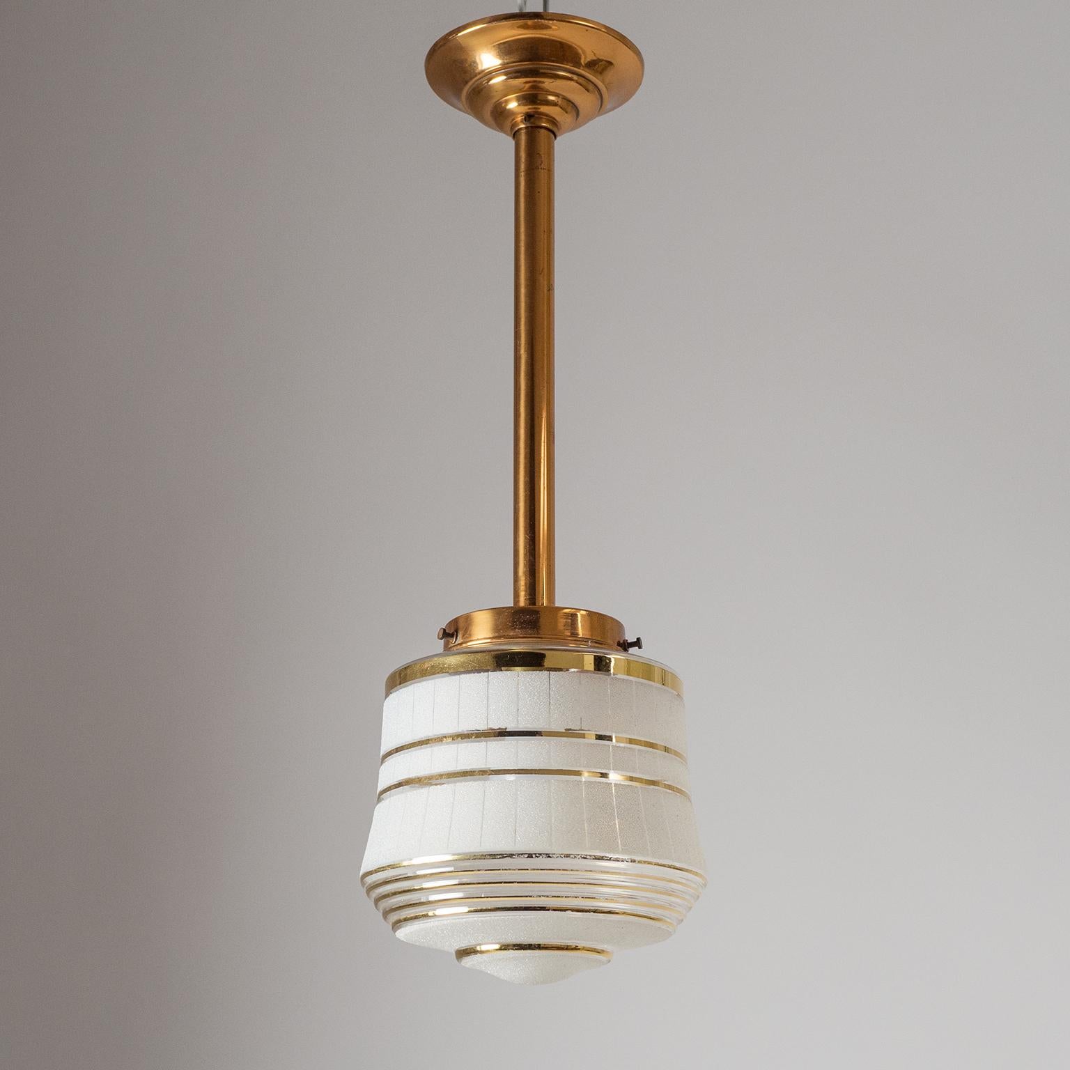 Lovely French Art Deco ceiling light from the late 1940s. Rare all copper hardware with a tiered, clear glass diffuser which is partially frosted and has several gold rims emphasizing the tiered shape of the glass. Very nice original condition with