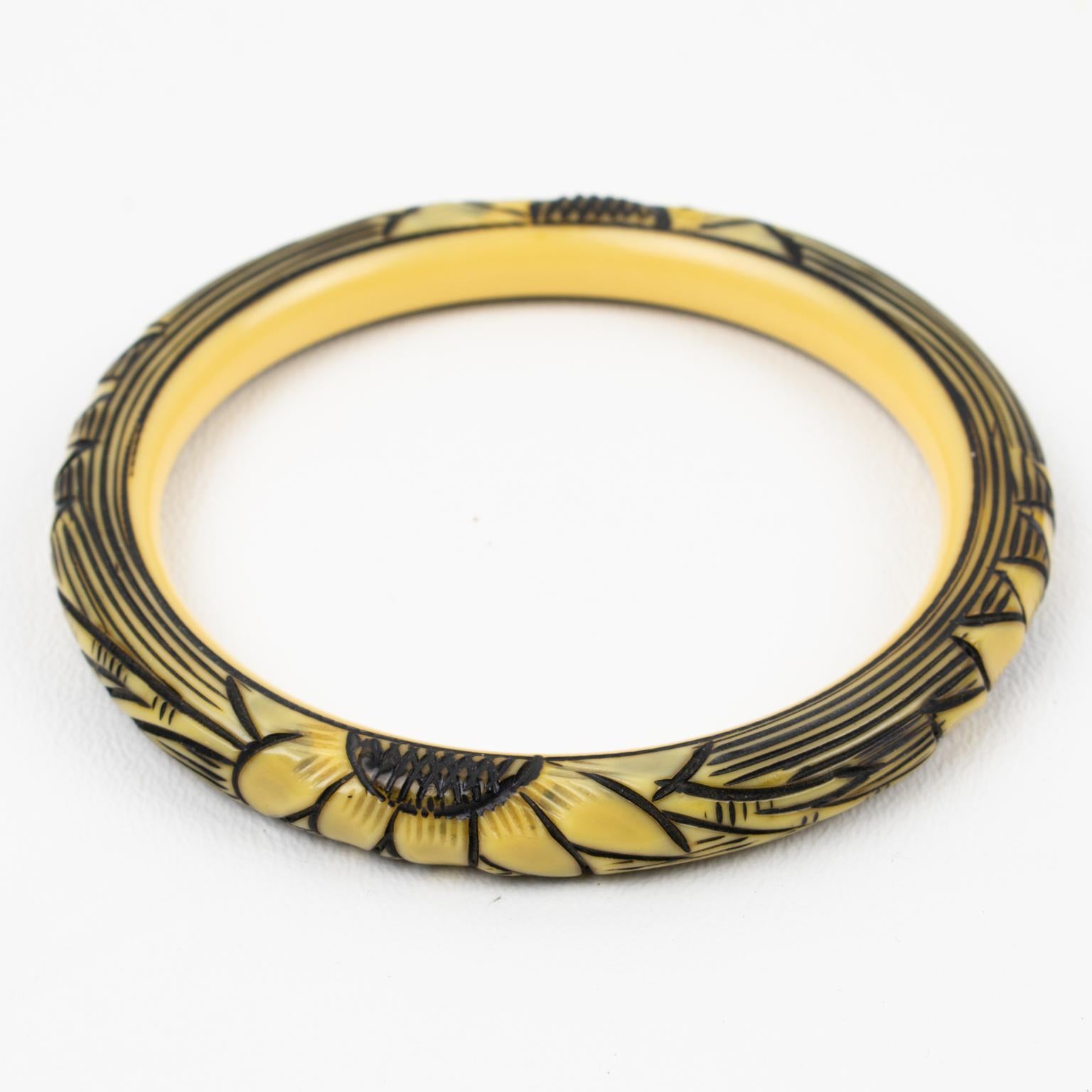 This lovely 1925s Art Deco celluloid bracelet bangle features a floral design with four motifs all around the bracelet. The design is deeply carved, painted, and stained. The bangle boasts assorted colors of off-white, yellow, and