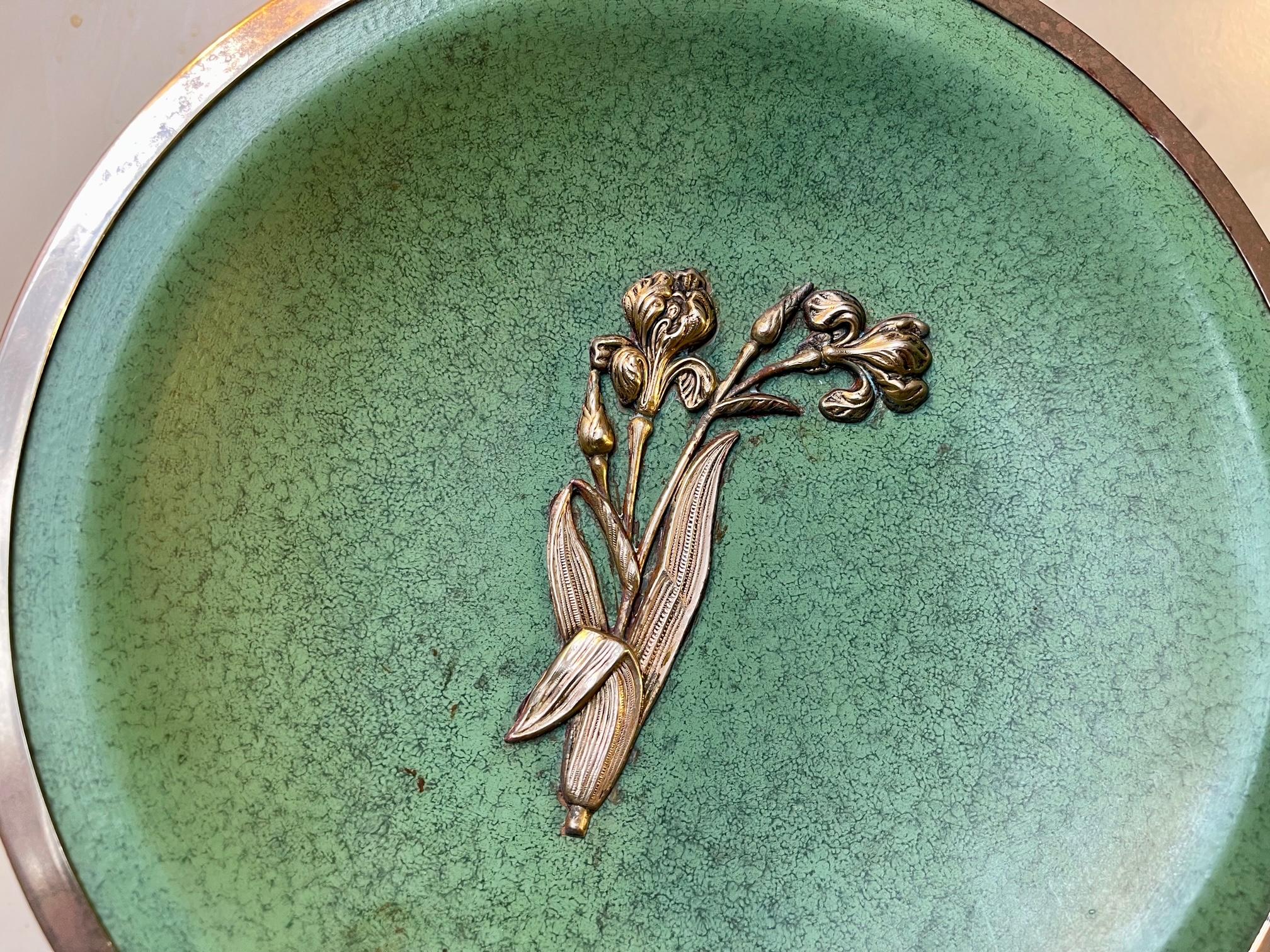 Unusual French stoneware dish decorated in green glaze and highlighted with bronze band and stylized flower. Unknown French ceramist/workshop circa 1920s or 30s in a style reminiscent of Jean Besnard. It has no markings. Measurements: D: 26.5 cm, H: