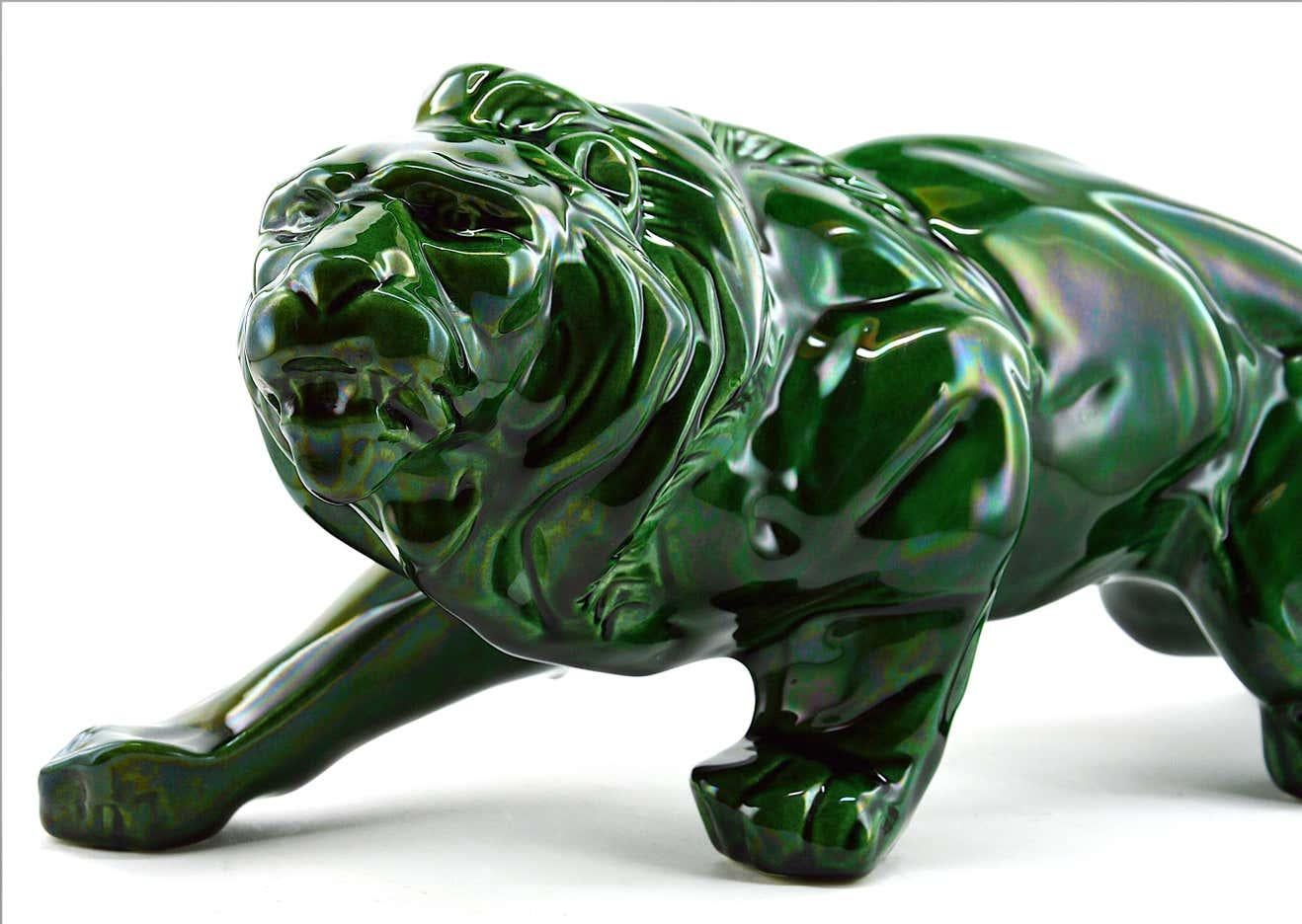 Green lion, France, 1930s. Ceramic. This lion has been made in black, green and red. This is the green one! Measures: Width 18.9