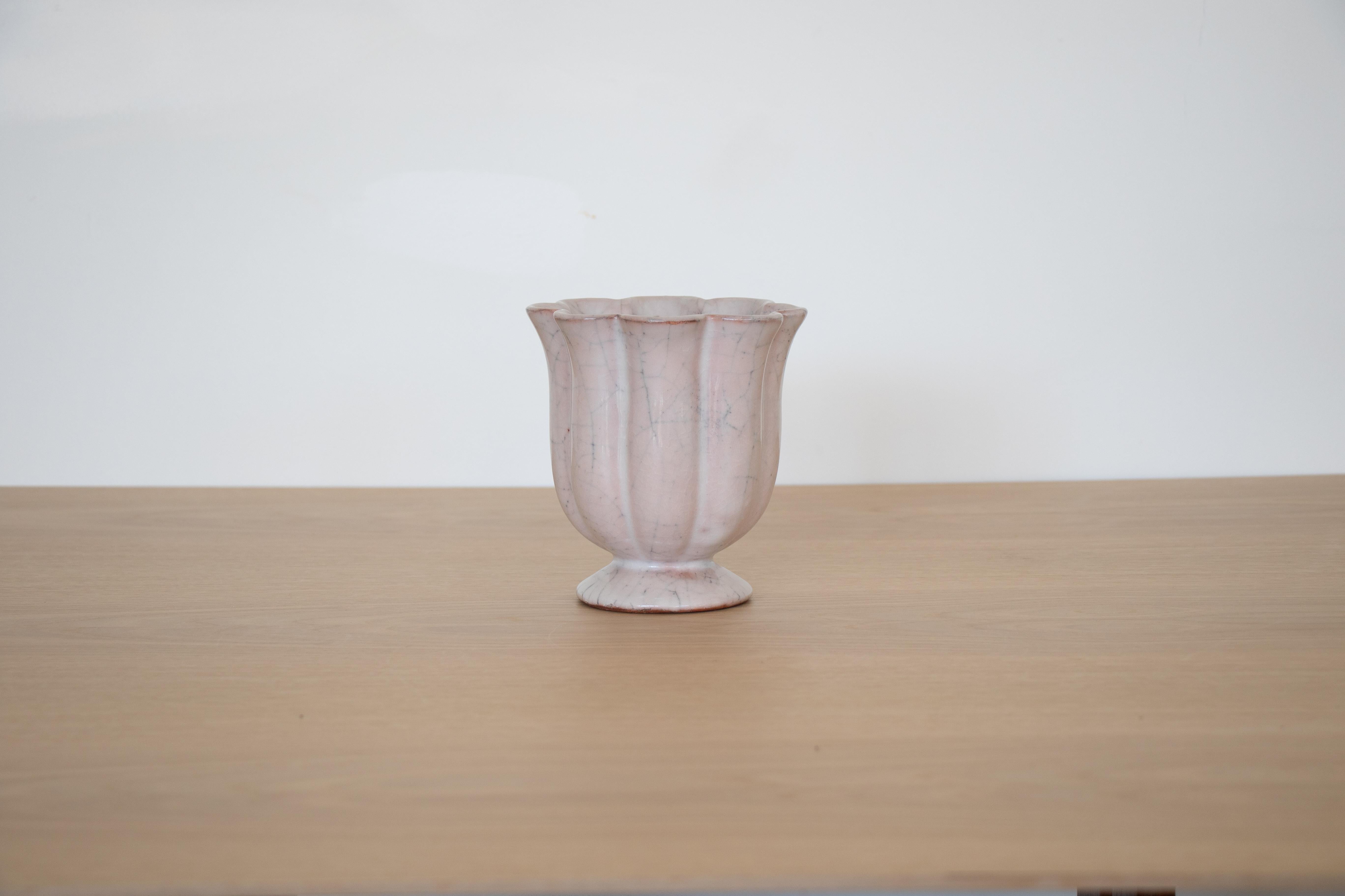 Vintage French Art Deco ceramic vase in a light blush color and scalloped edge detail.