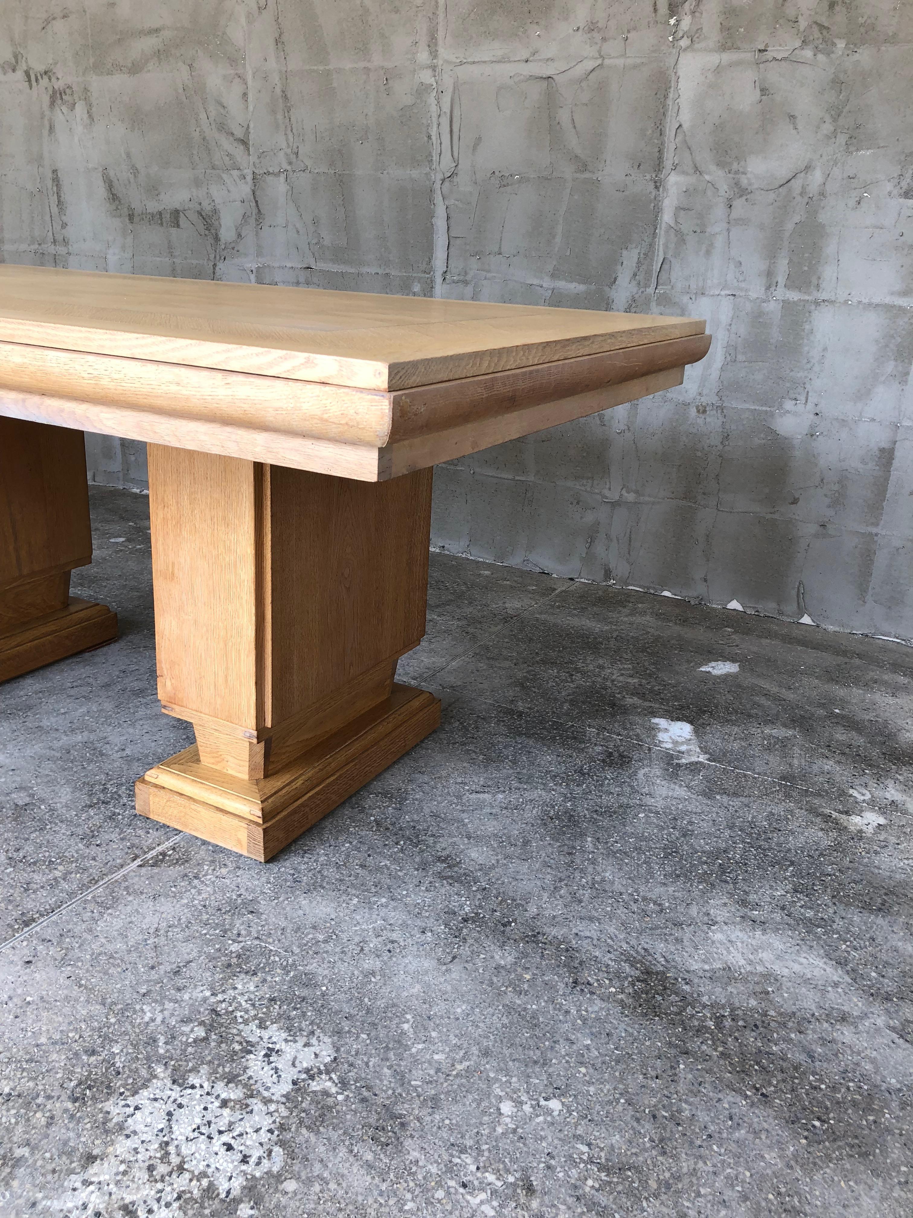 Solid but very stylished French art deco dining table by the famous French designer Gaston Poisson, made from cerused oak. The top is decorated with marquetry. There is one restored spot on the top of the table. But still in very good condition. The