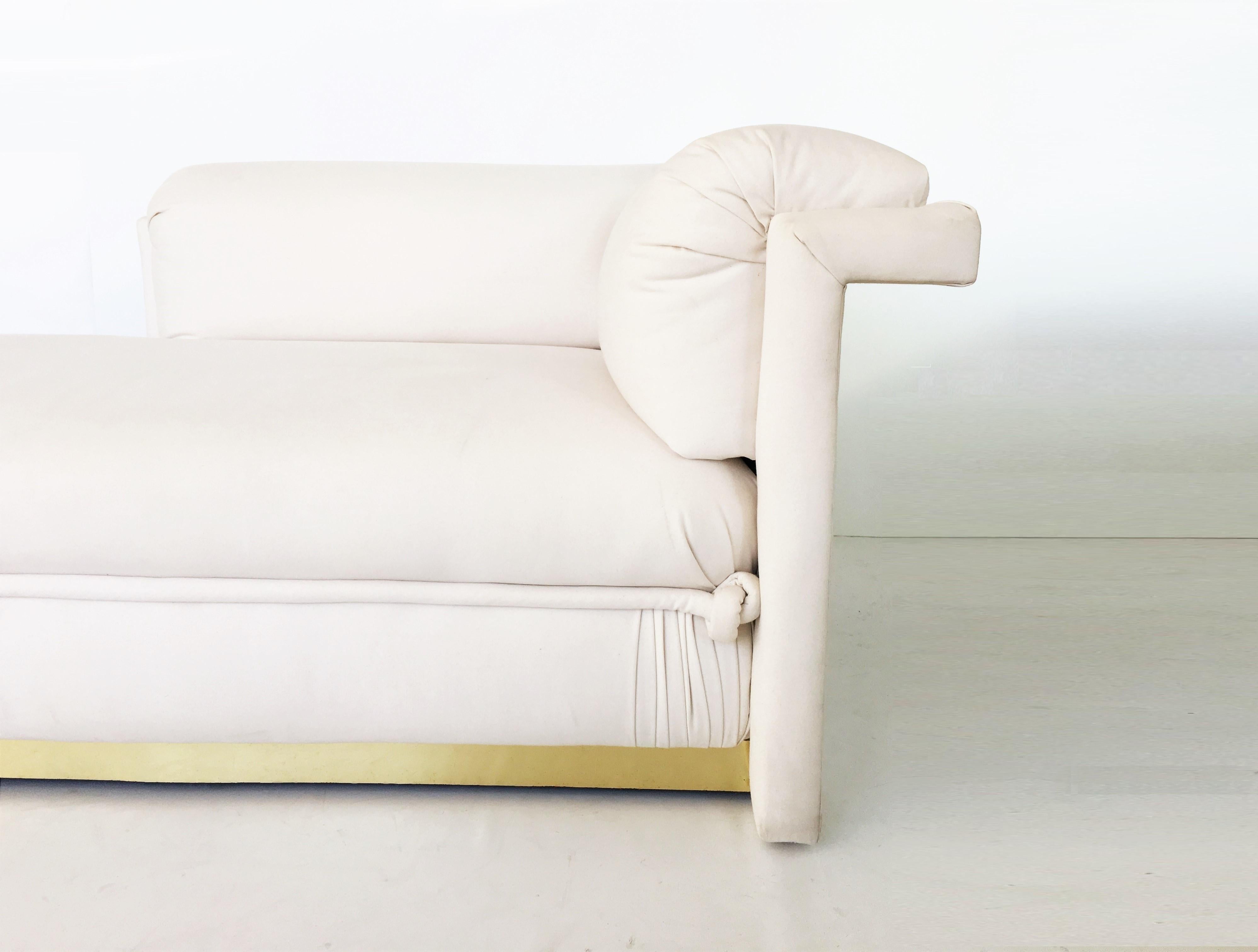 Unusual French Art Deco chaise longue with brass base. This exquisite chaise longue that combine the most contemporary shape. Newly upholstered with beautiful rope detailing and raised upon brass plinth base so they appear to float. Very comfortable.
