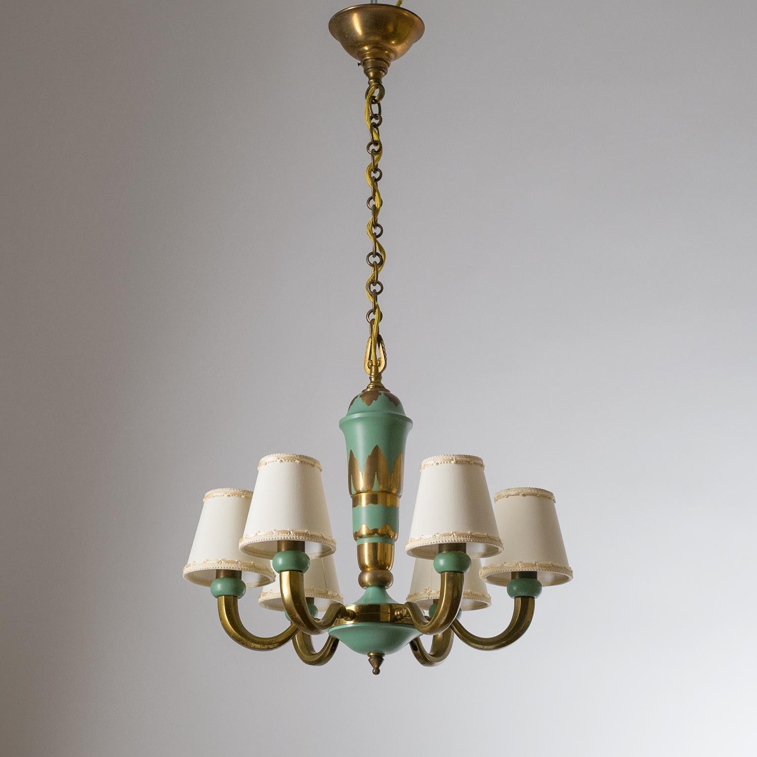 Fine French Art Deco chandelier from the 1930-1940s. All brass construction, partially enameled in a subdued green. Very nice condition with some patina on the brass and minor wear to the original lacquer. Brass and ceramic E14 sockets with new