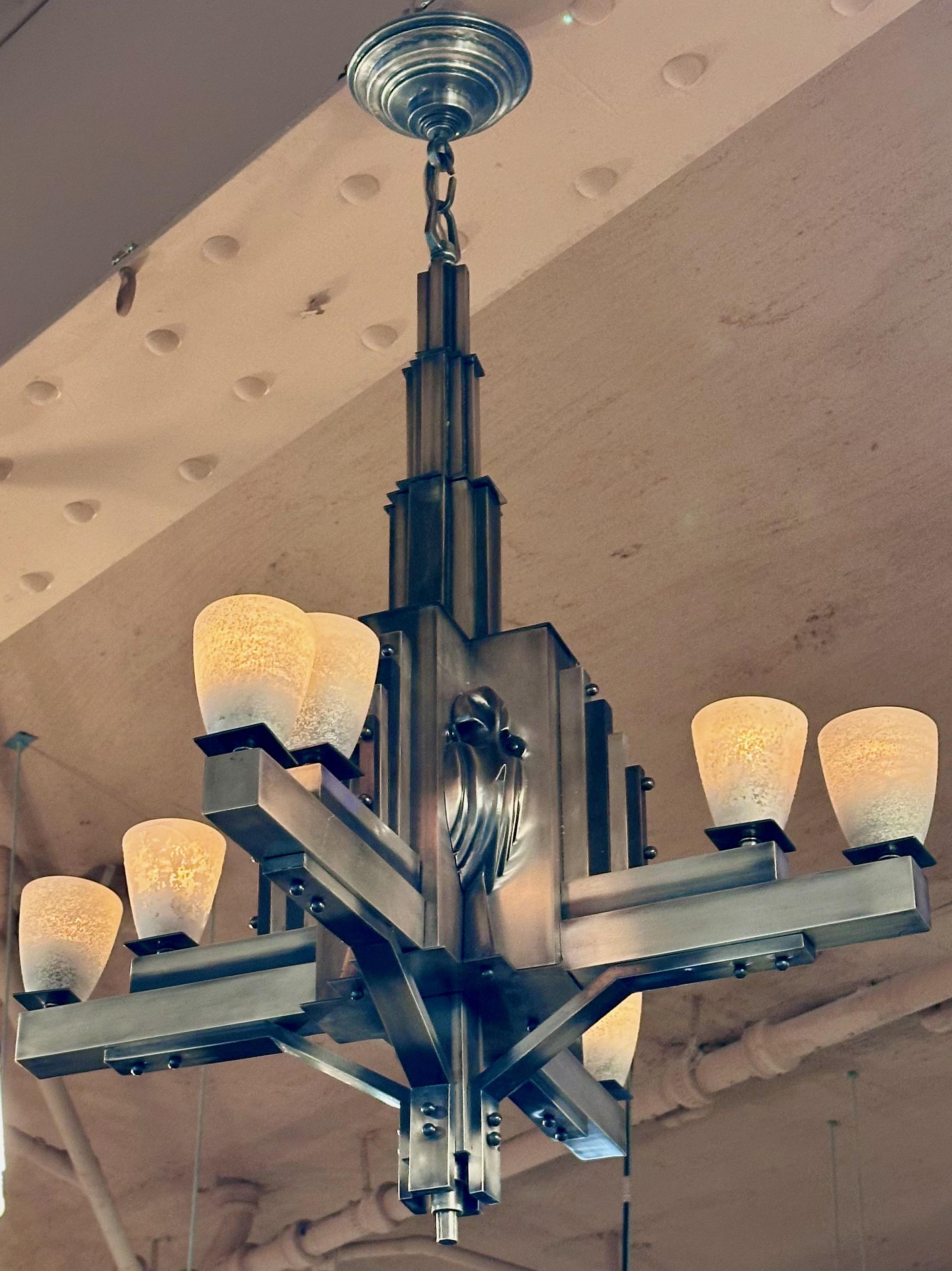 French Art Deco Chandelier Antique Nickel Modernist rare chandelier featuring a Marabou stork motif. Art Deco design is known for its geometric shapes, and luxurious materials, and this light has a particular modernist and cubist style. There are 4