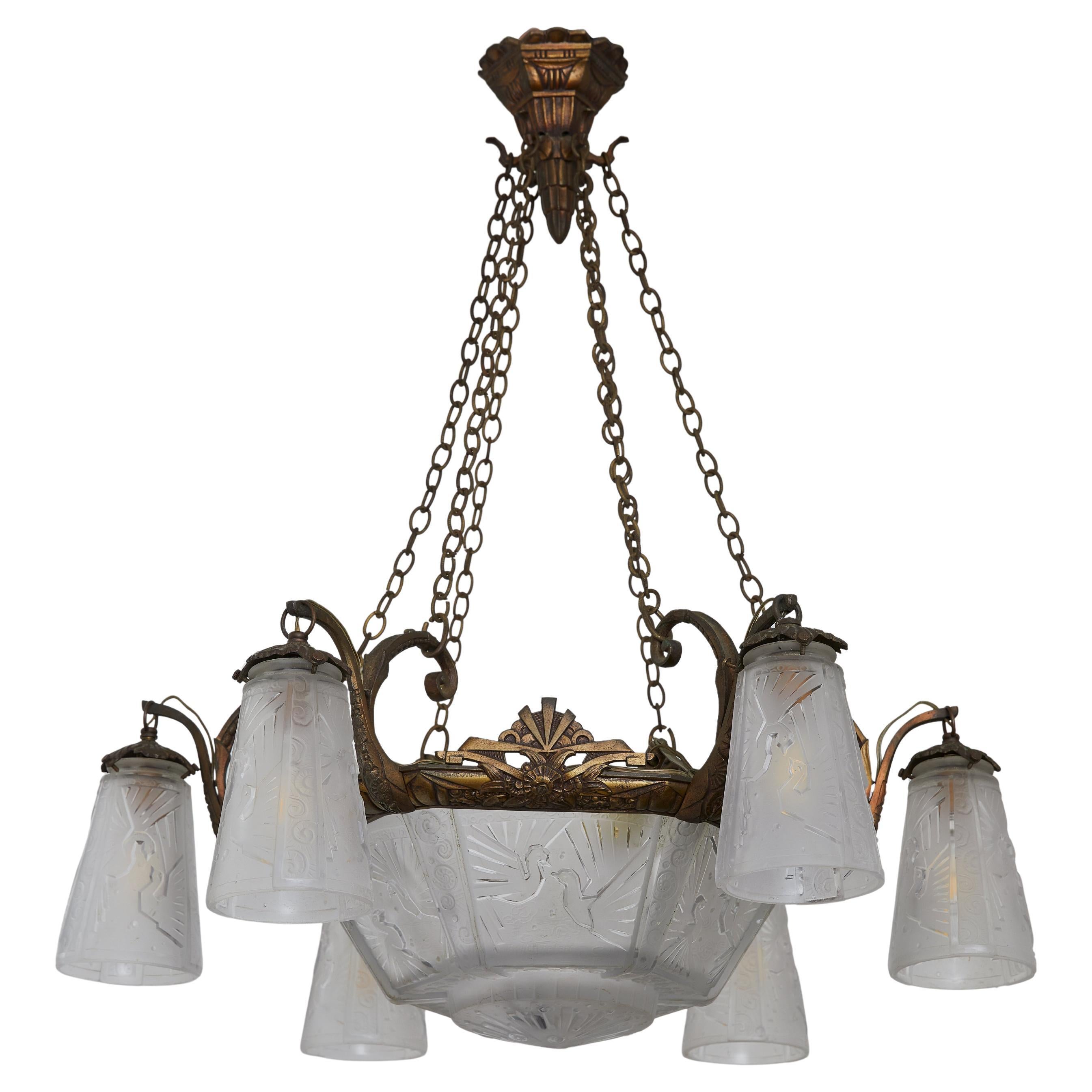 An exquisite French Art Deco chandelier attributed to the renowned glassmakers Müller Frères, this stunning fixture exemplifies the refined craftsmanship of the early 20th century. Featuring a gracefully aged brass frame with intricate scrolling