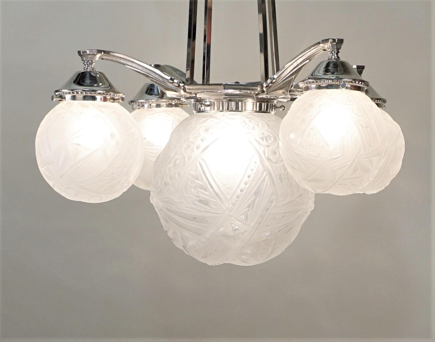 French five glob geometric clear Frost glass and polished nickel chandelier by Muller Freres.