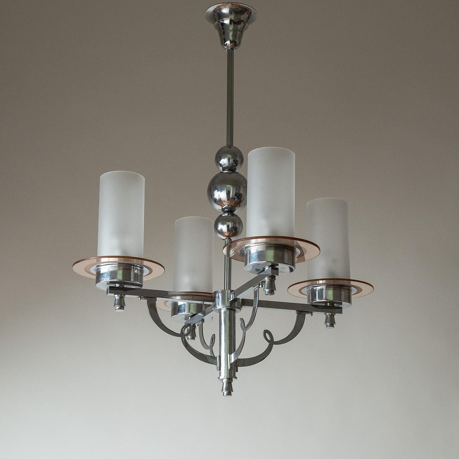 French chrome and glass Art Deco chandelier from the 1930-1940s. Decorative chromed-brass structure with frosted glass tubes and rosé-tinted glass discs. Nice original condition with a minimal patina on the chrome and a small chip on one of the