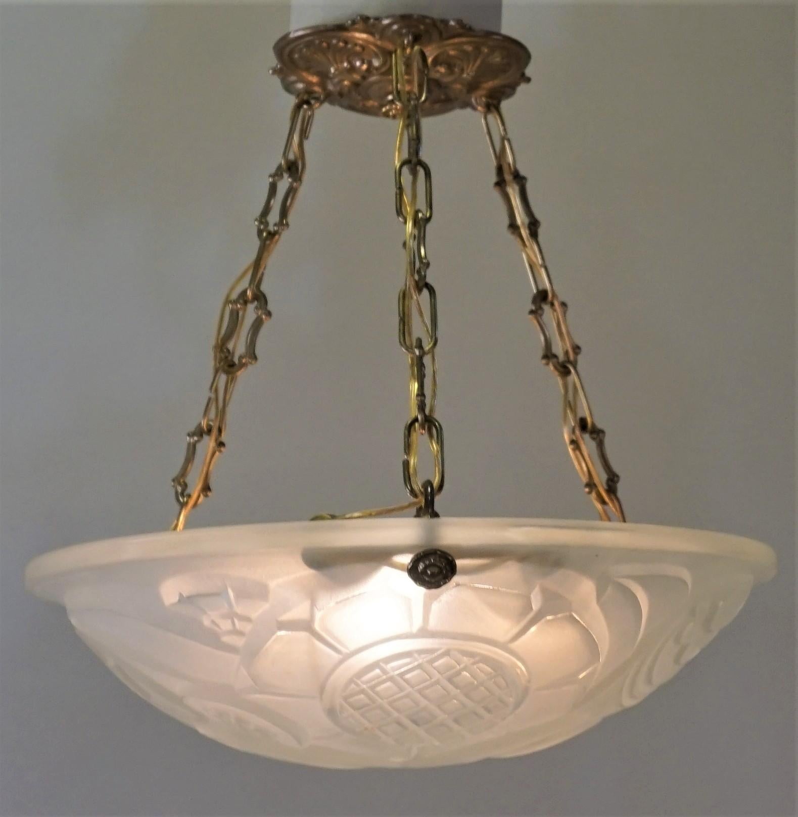 Clear frost glass with bronze hardware Art Deco chandelier.
Total of six lights 60 watts each
Measures: 13.5