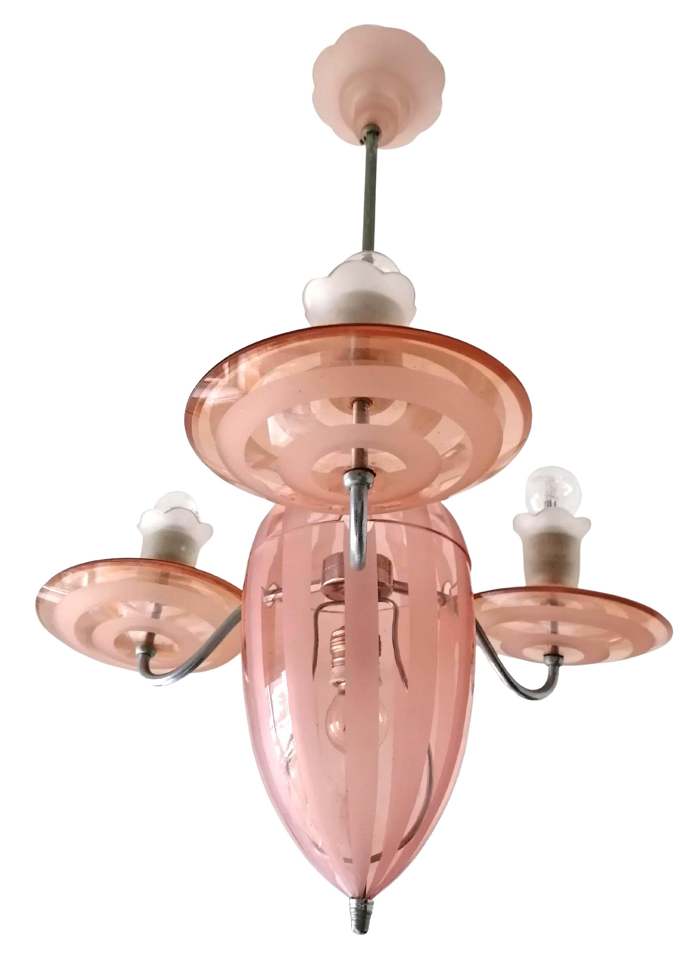 
Superb and unusual French Art Deco chandelier in Pink Etched Glass Stripes and Chrome Brass C1920
Cleaned and with porcelain sockets it was rewired and it accommodates 4 household bulbs E-26.Good working condition, 
Assembly required.
 