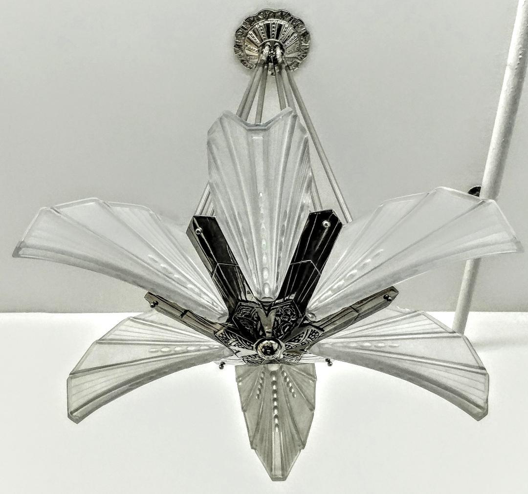 French Art Deco chandelier by the French artist Atelier E.J.G. six shades in clear frosted glass with palm leaf design details. Each glass shade marked EJG FRANCE. Rest on a geometrically designed frame in nickel bronze. Replated and rewired to U.S.