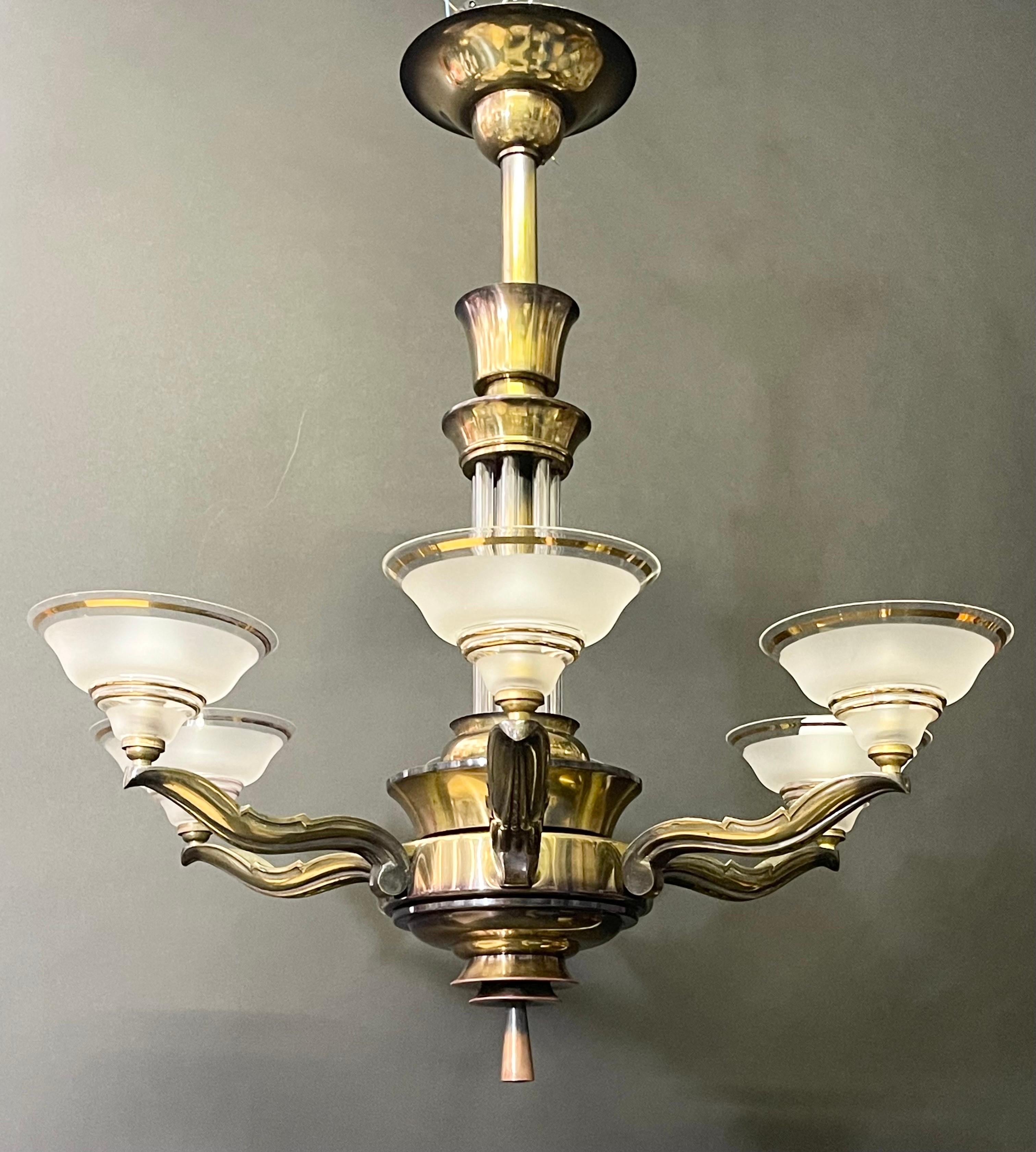 A wonderful, very elegant art deco six-arm chandelier attr. to Petitot, France, circa 1930s.
The fixture takes 6 x B22 bulbs (French bajonnett) for illuminate.
The condition is excellent and with replacement glasses.
   
