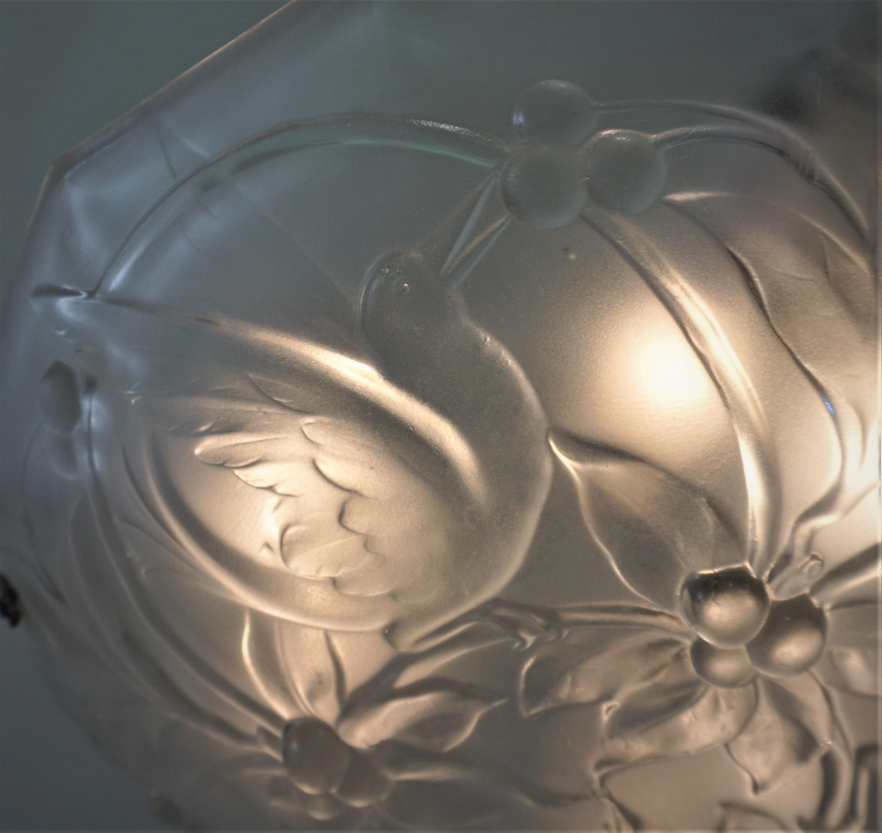 Clear frost glass with birds eating cherries art deco chandelier with nickel on bronze hardware.
Six lights max 60 watt each.