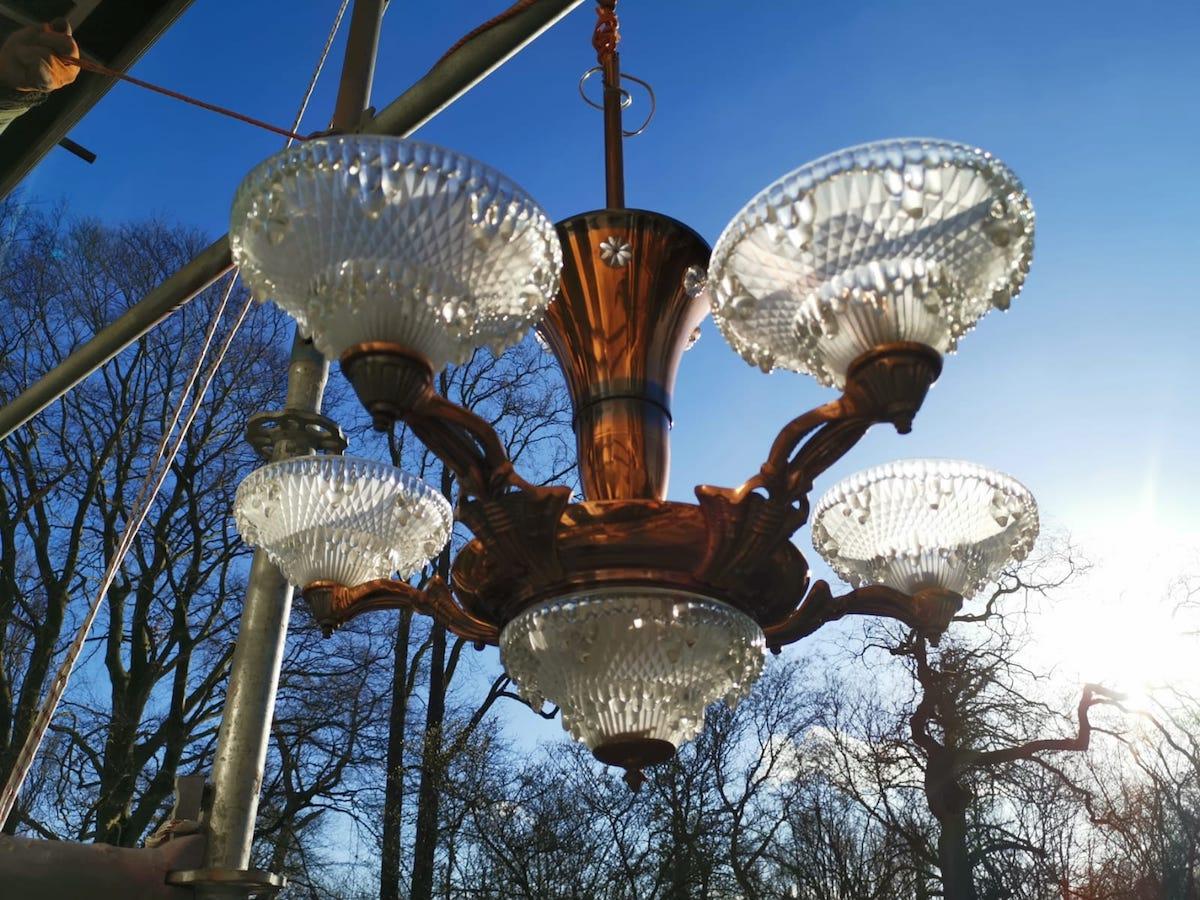 Ezan and Petitot attributed. A French Art Deco five branch copper Chandelier with the original set of five opaque icicle design molded glass shades.
In wonderful original condition.