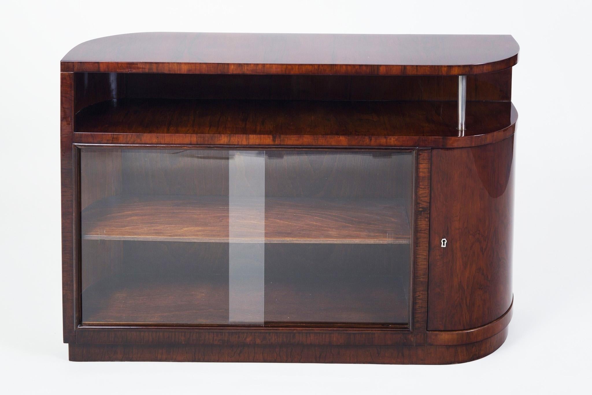 Art Deco cabinet with shelves from Czech Republic.
Period: 1930-1939.
Material: Palisander
Completely restored and the surface was made by piano lacquers to the high gloss.