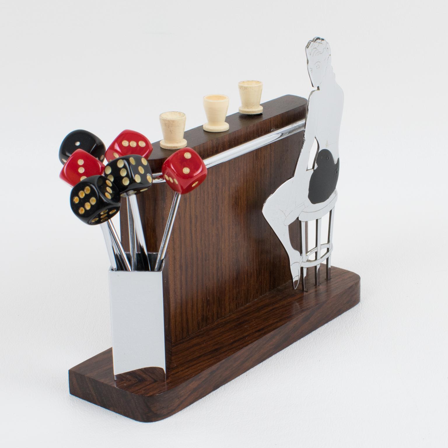 Lovely French Art Deco barware set cocktail picks, featuring a miniature Macassar wood bar with a lady seated on a barstool. The wood bar holds 3 cocktail picks with white Galalithe glasses finial. On the left side of the bar, a chromed metal stand
