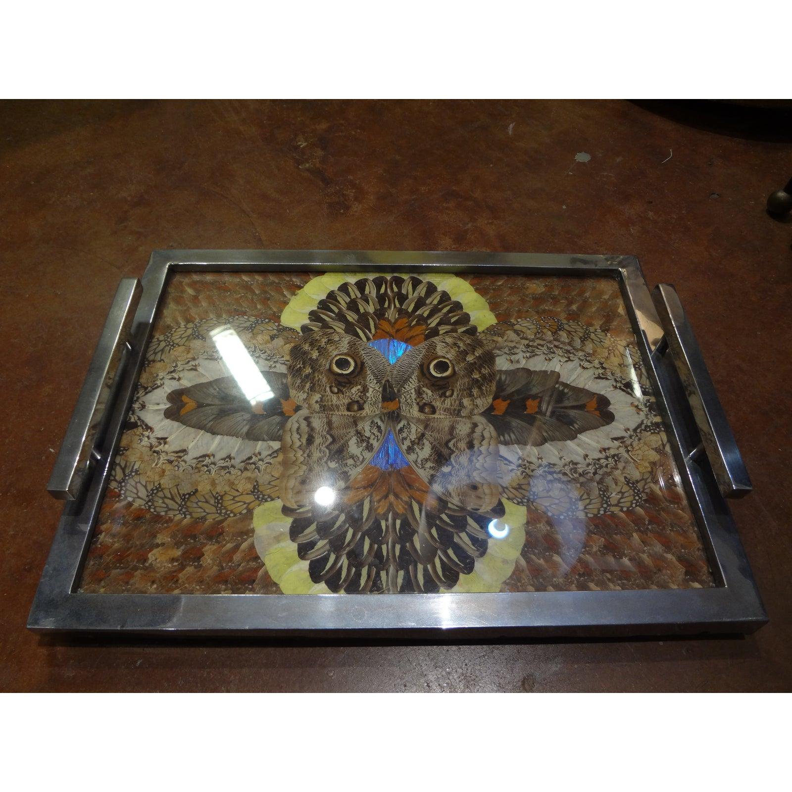 Stunning 1930s French Art Deco chrome tray with handles adorned with butterfly wings which were artistically placed under glass. A great conversation piece. Perfect for serving drinks, as a cocktail table accessory, used as a vanity tray or in a
