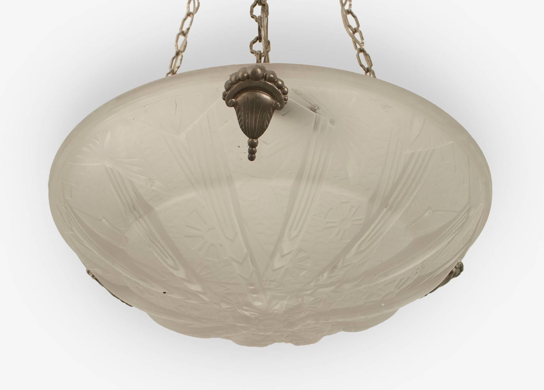 French Art Deco (circa 1925) round pendant form frosted glass chandelier with a molded geometric design & sunburst bottom suspended by 3 chains to a canopy (signed MULLER)
