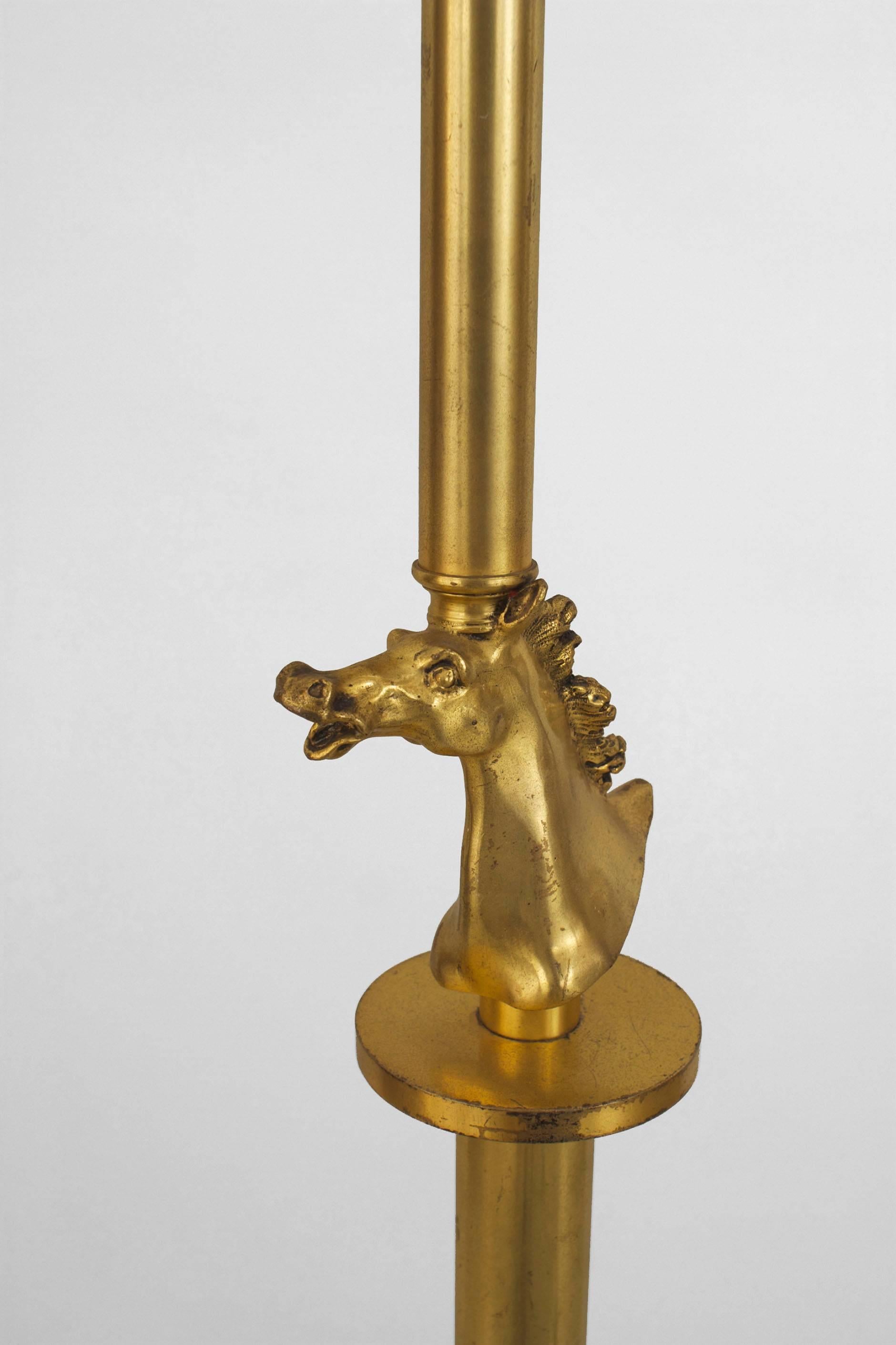 French Art Deco (circa 1930) gilded bronze floor lamp with a centered horse head on a cylindrical shaft and resting on a round brown marble base.
