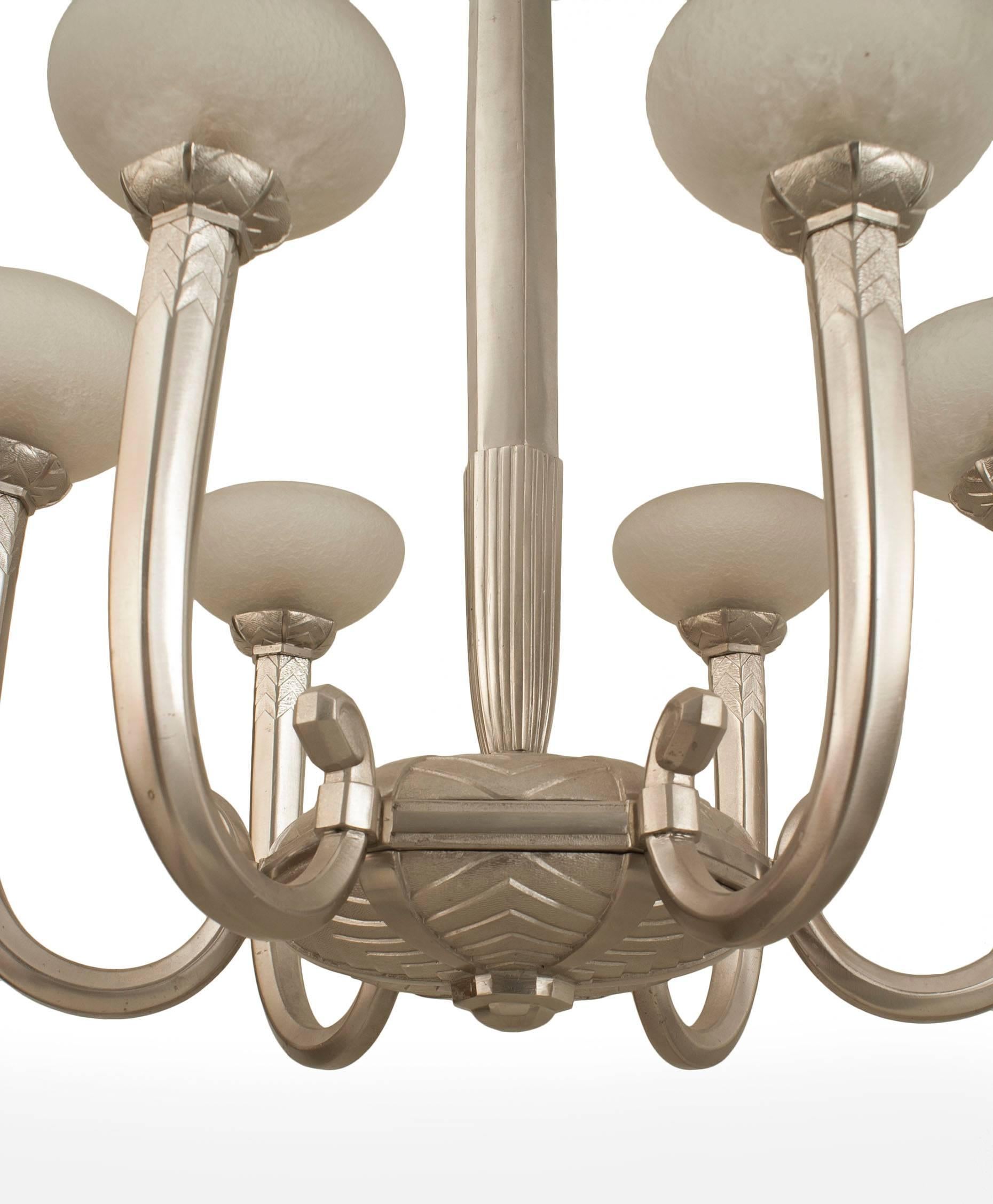 French Art Deco (circa 1930) silvered bronze 6 arm chandelier supporting acid etched glass shades emanating from a geometric design center & center post (Glass attributed to Schneider).
  