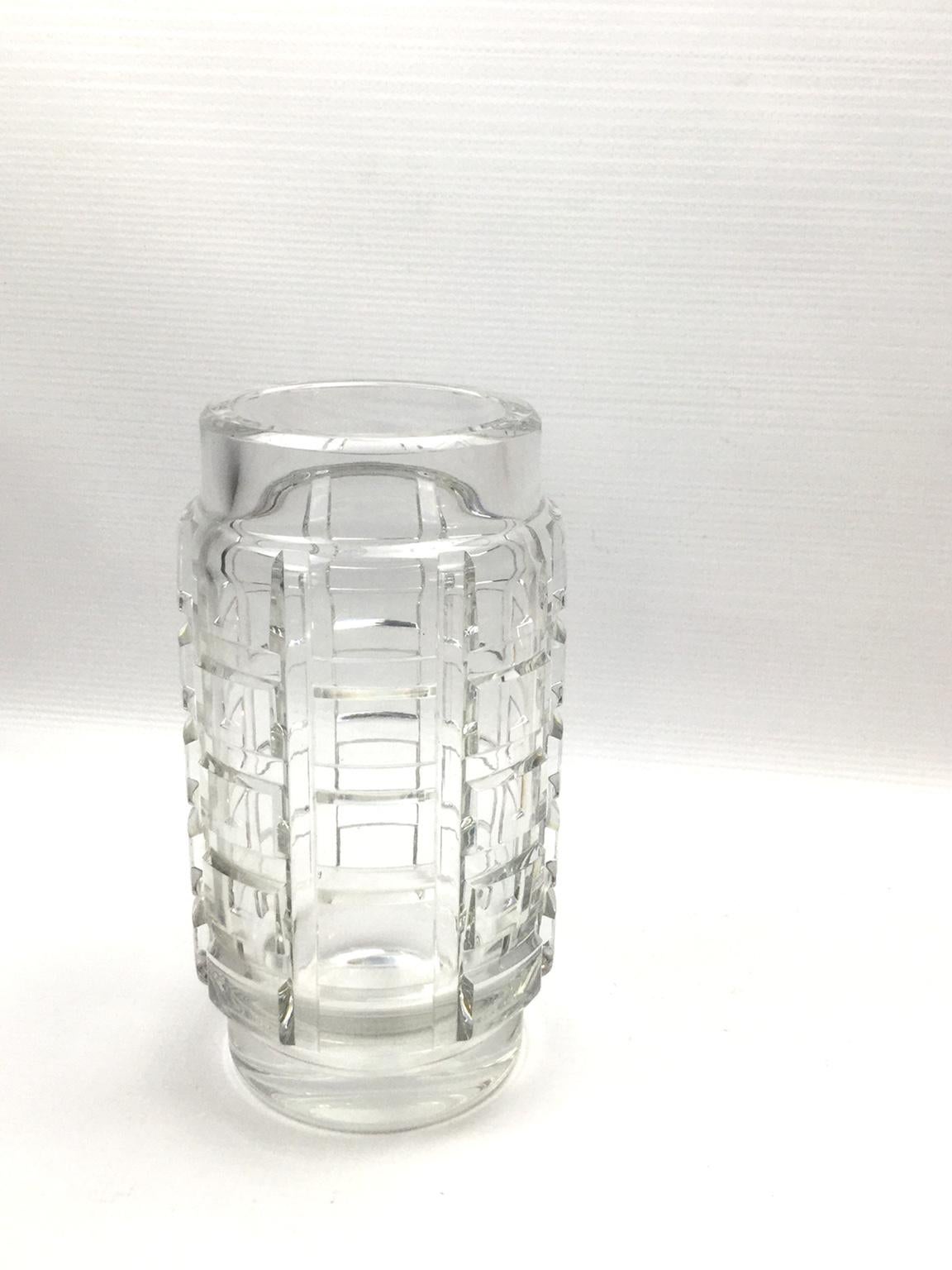 1940s clear crystal vase by Baccarat in the style of Georges Chevalier,
The fine horizontal bevel cuts create a stunning interplay of light.


    