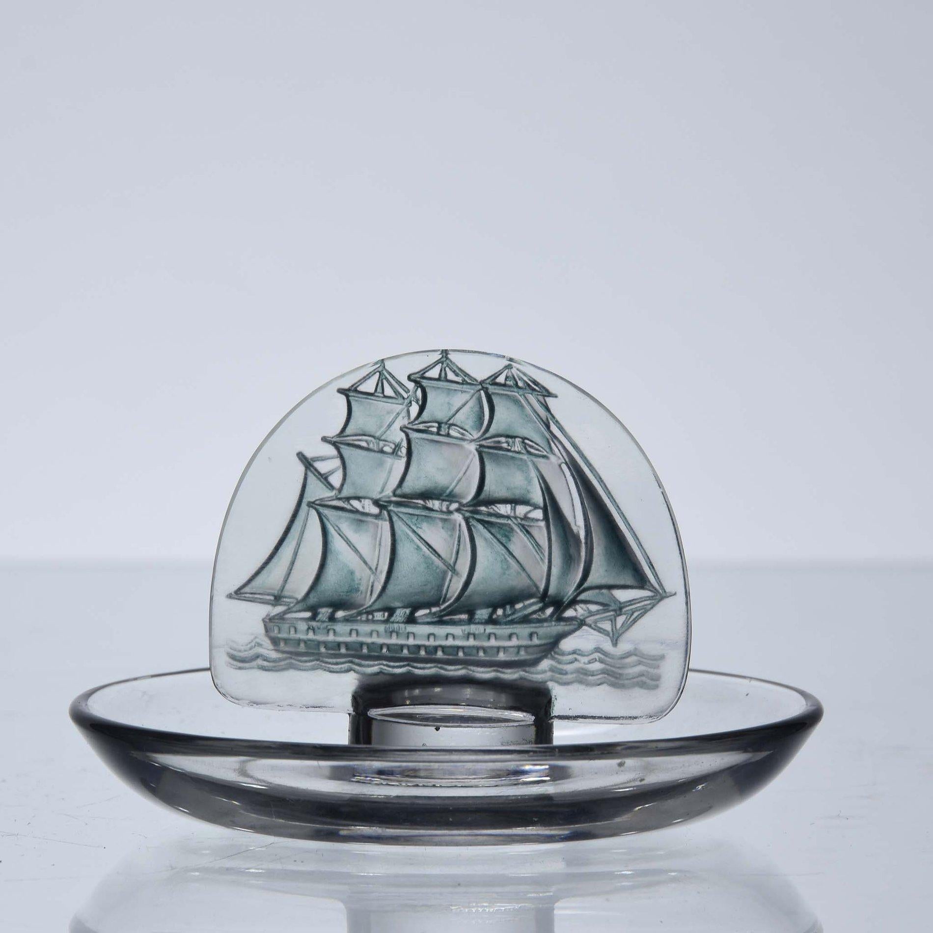 An attractive early 20th century French clear and blue stained glass pintray deeply engraved with a Caravel sailing ship at full sail, signed R Lalique 
 
Cendrier Rond 