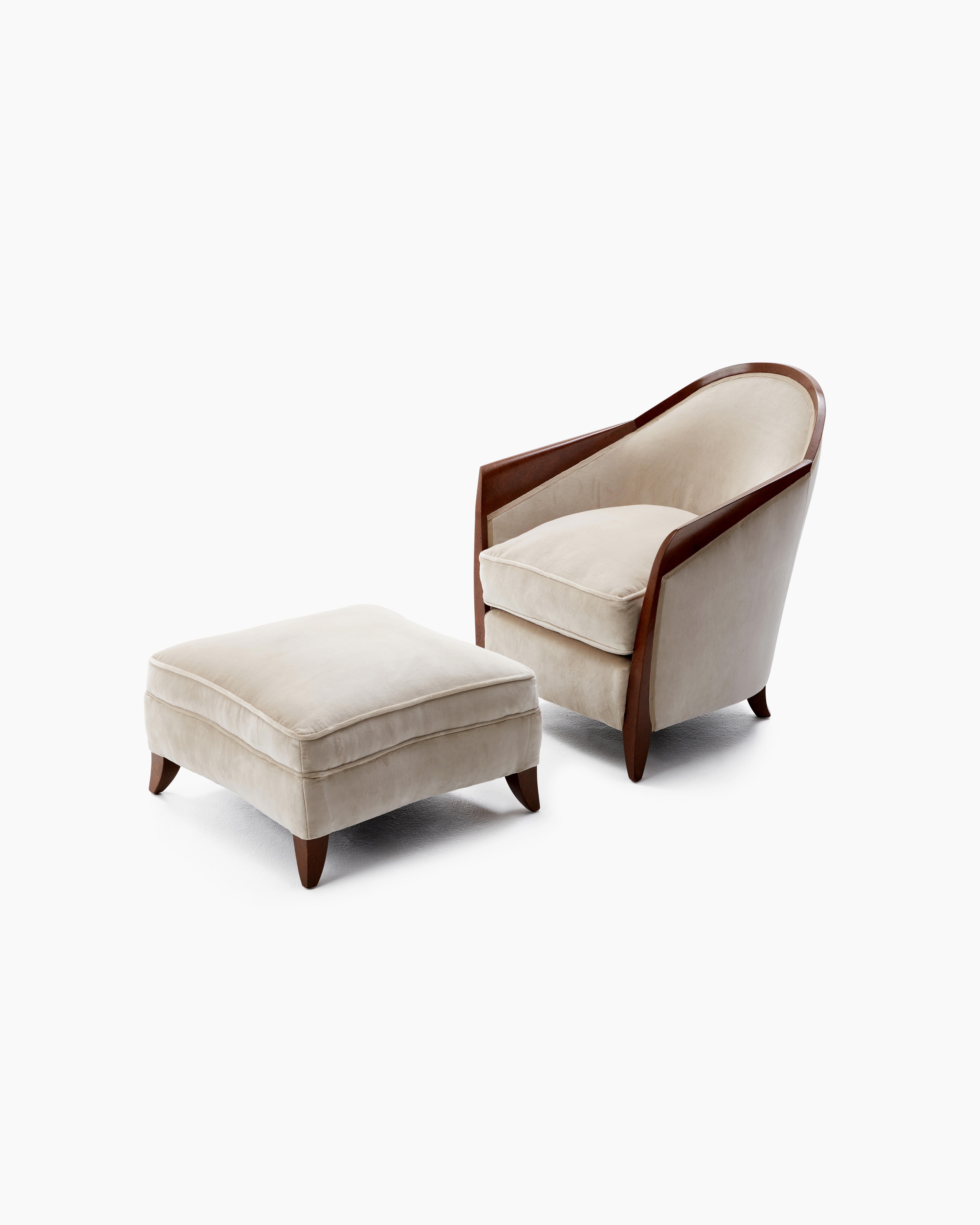 This original armchair and footstool in the style of distinguished French interior design firm Dominique, dating back to the 1930s Art Deco era, upholds the essential characteristics of understated luxury and sophistication of form.

Restored to