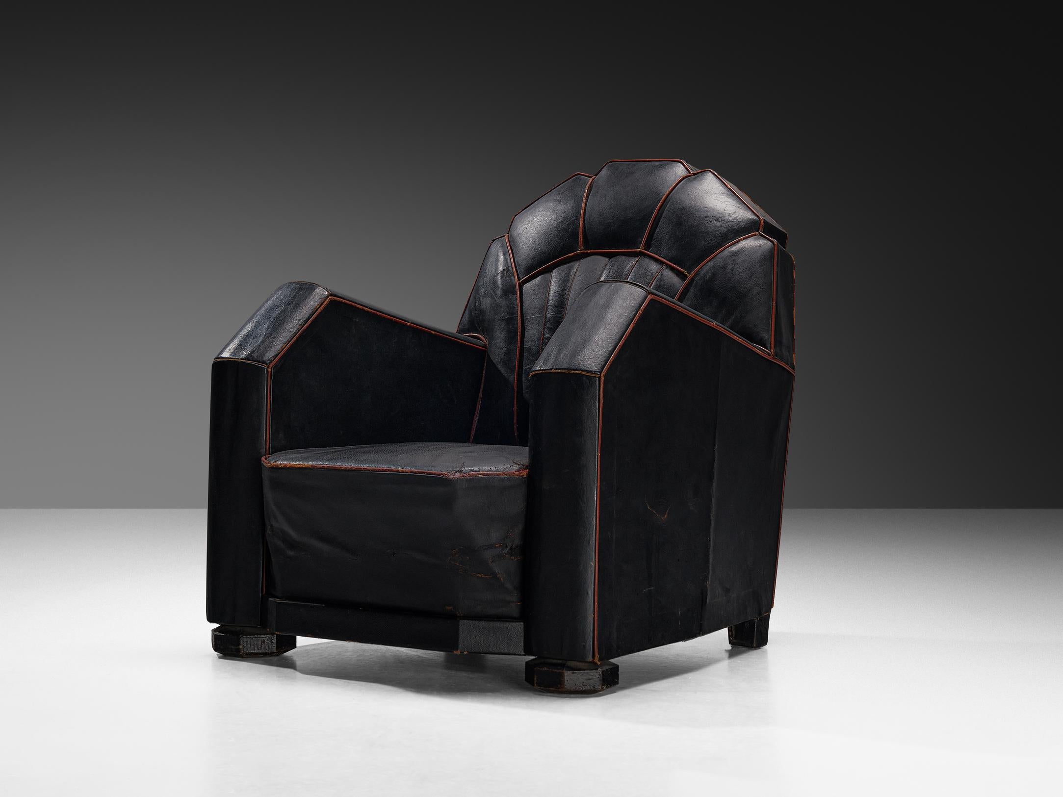 Lounge chair, leather, wood, France, 1930s

This armchair of French origin undoubtedly breathes the Art Deco Period of the 1930s. The chair features beautiful streamlined lines and sharp edges. The contours are beautifully highlighted by the red