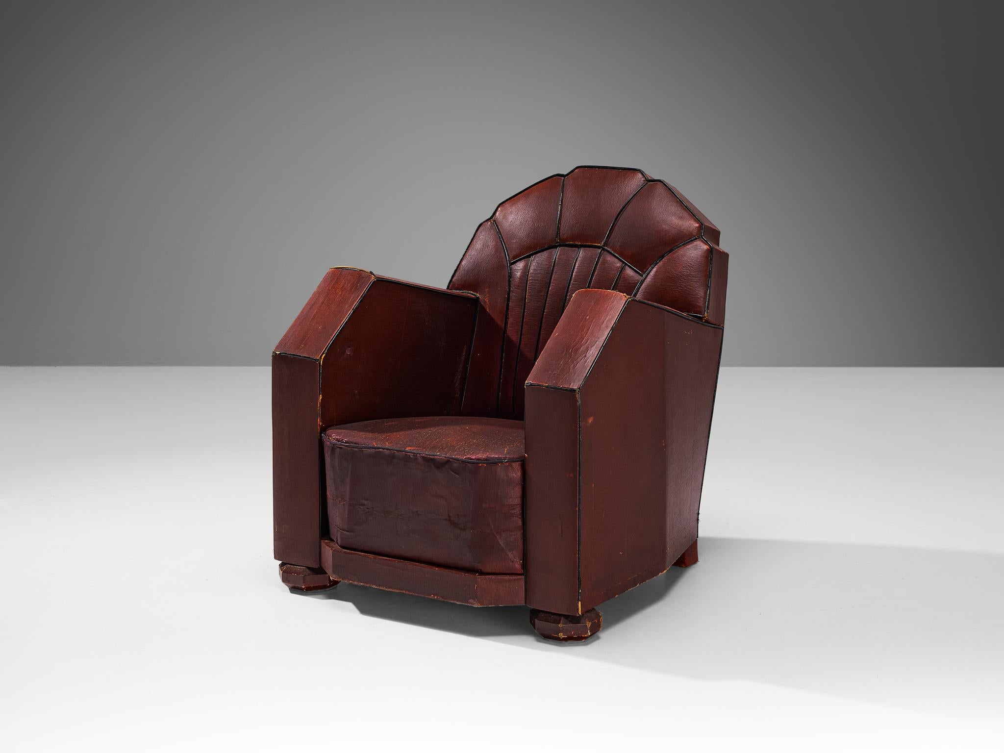 Lounge chair, burgundy red leather, wood, France, 1930s

This armchair of French origin undoubtedly breathes the Art Deco Period of the 1930s. The chair features beautiful streamlined lines and sharp edges. The contours are beautifully highlighted