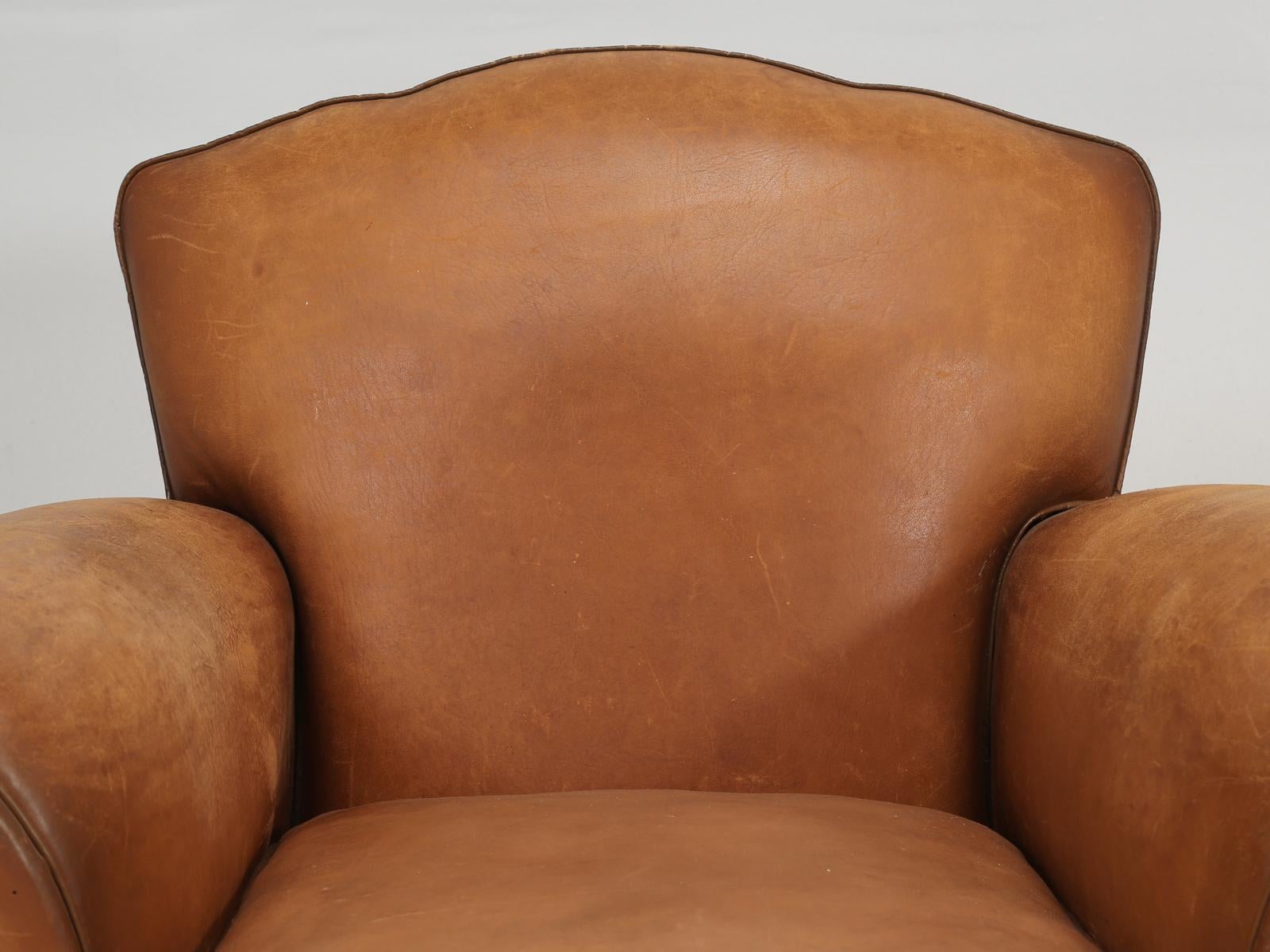 French Art Deco Club Chair from the 1930’s and in remarkable original condition. Inside the French leather club chair, we rebuilt the frame as needed and added horsehair for padding as per the original club chairs. What is quite unusual, is how