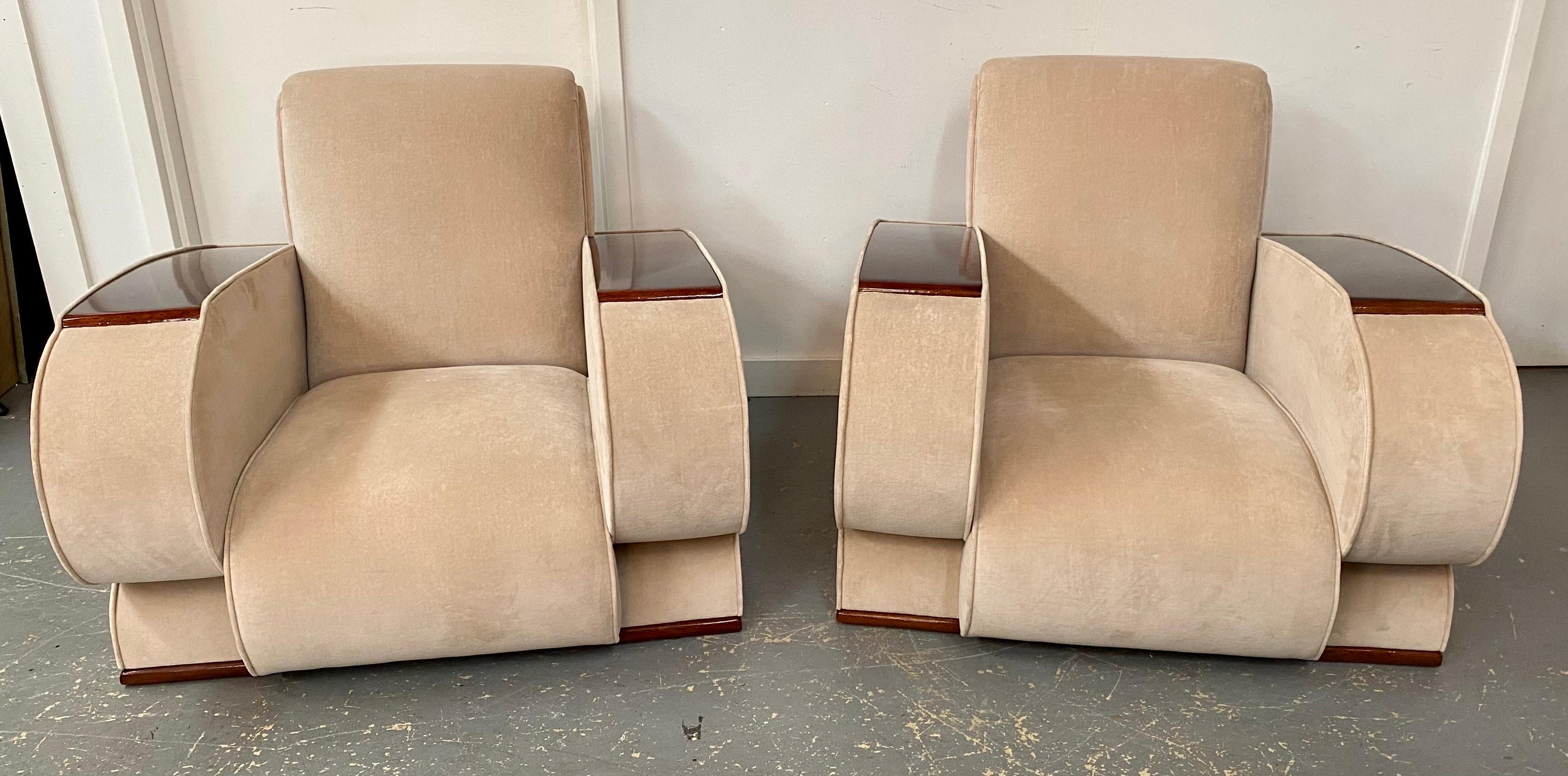A pair of French Art Deco lounge or club chairs. These distinguished seats, resplendent in their design, exude an air of refined luxury that epitomizes the Art Deco aesthetic.
The upholstery, a sumptuous suede rendered in a tasteful shade of beige,