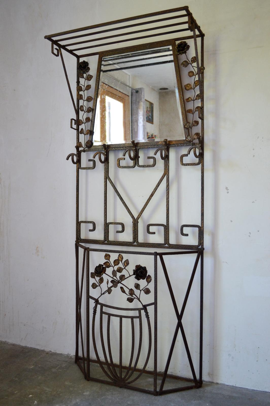 Amazing Art Deco coat-rack. 

Made in France, circa 1930. 

Wrought iron with light golden patina.

This beautiful coat rack is decorated with a floral theme: it is adorned with beautiful roses of a striking realism. This coat rack is of a