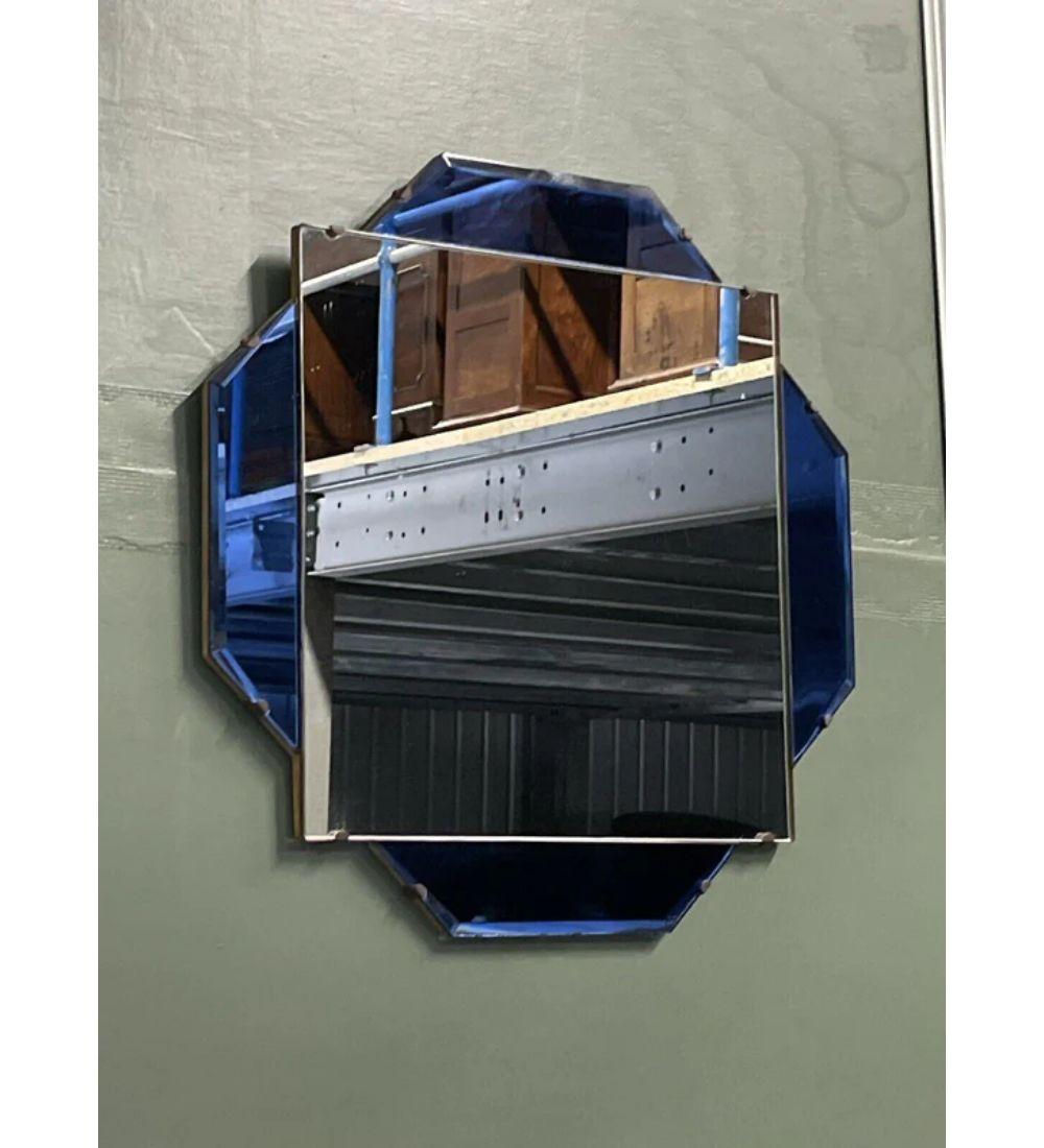 We are delighted to offer for sale this stunning 1930s French Art Deco cobalt blue bevelled wall mirror.

A very decorative piece will suit any room of the house. The back of the frame is made of oak and has the original chain. Each outer glass is