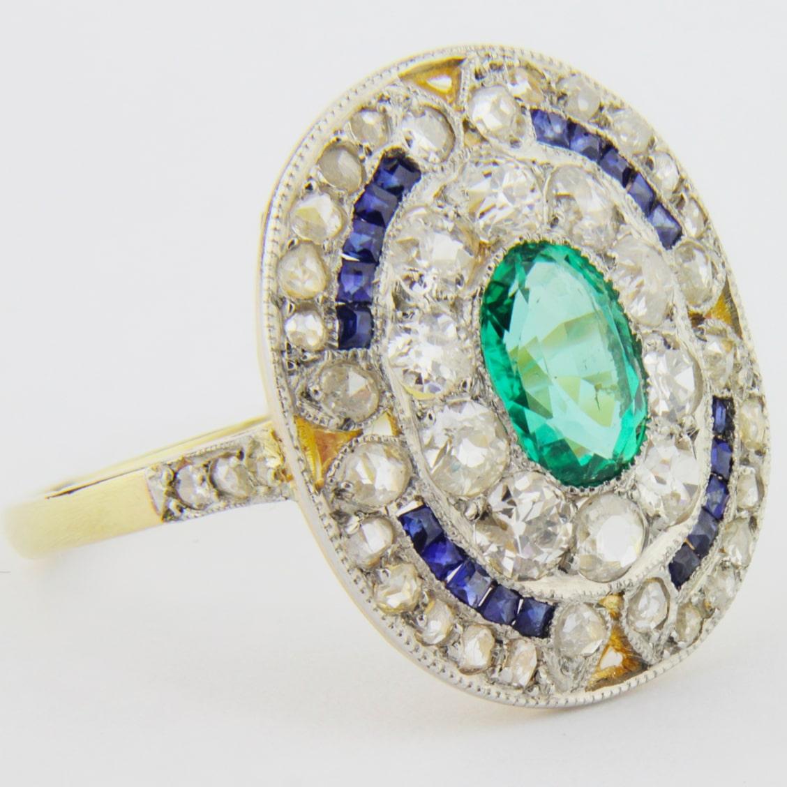 Oval Cut French Art Deco Cocktail Ring with an Emerald, Diamonds and Sapphires