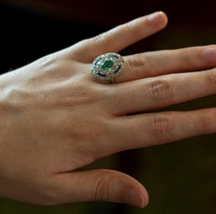 French Art Deco Cocktail Ring with an Emerald, Diamonds and Sapphires