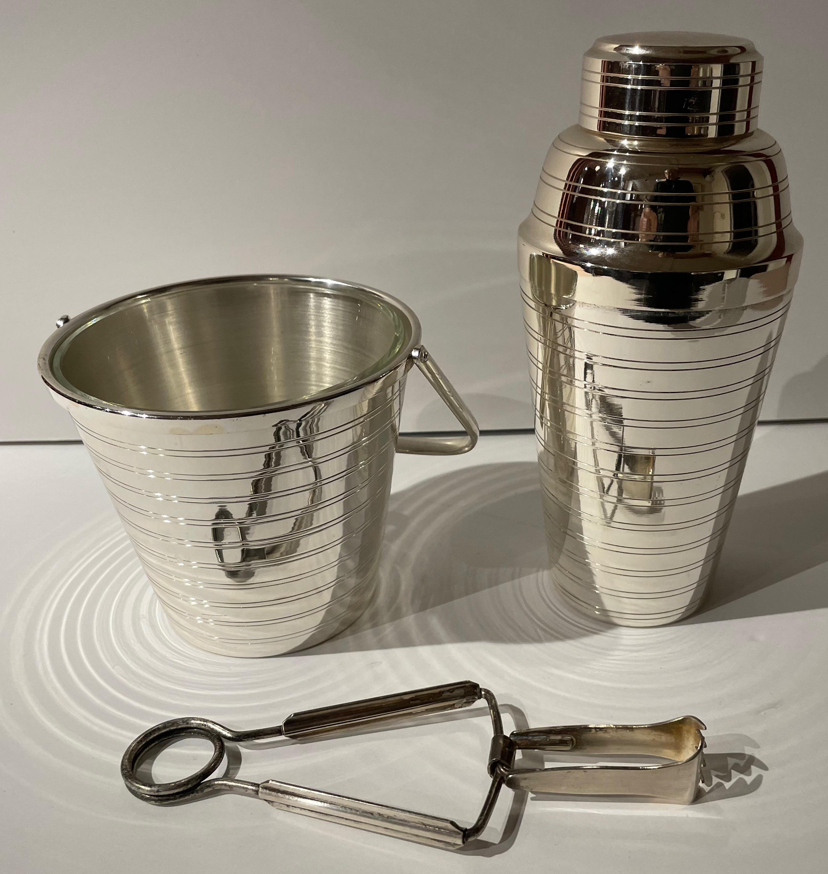 French Art Deco Cocktail Shaker Matching Ice Bucket and Tongs. Excellent original condition, beautifully matched set with original glass insert for ice, and a great pair of ice tongs to complete the service. We do not see these matched sets very