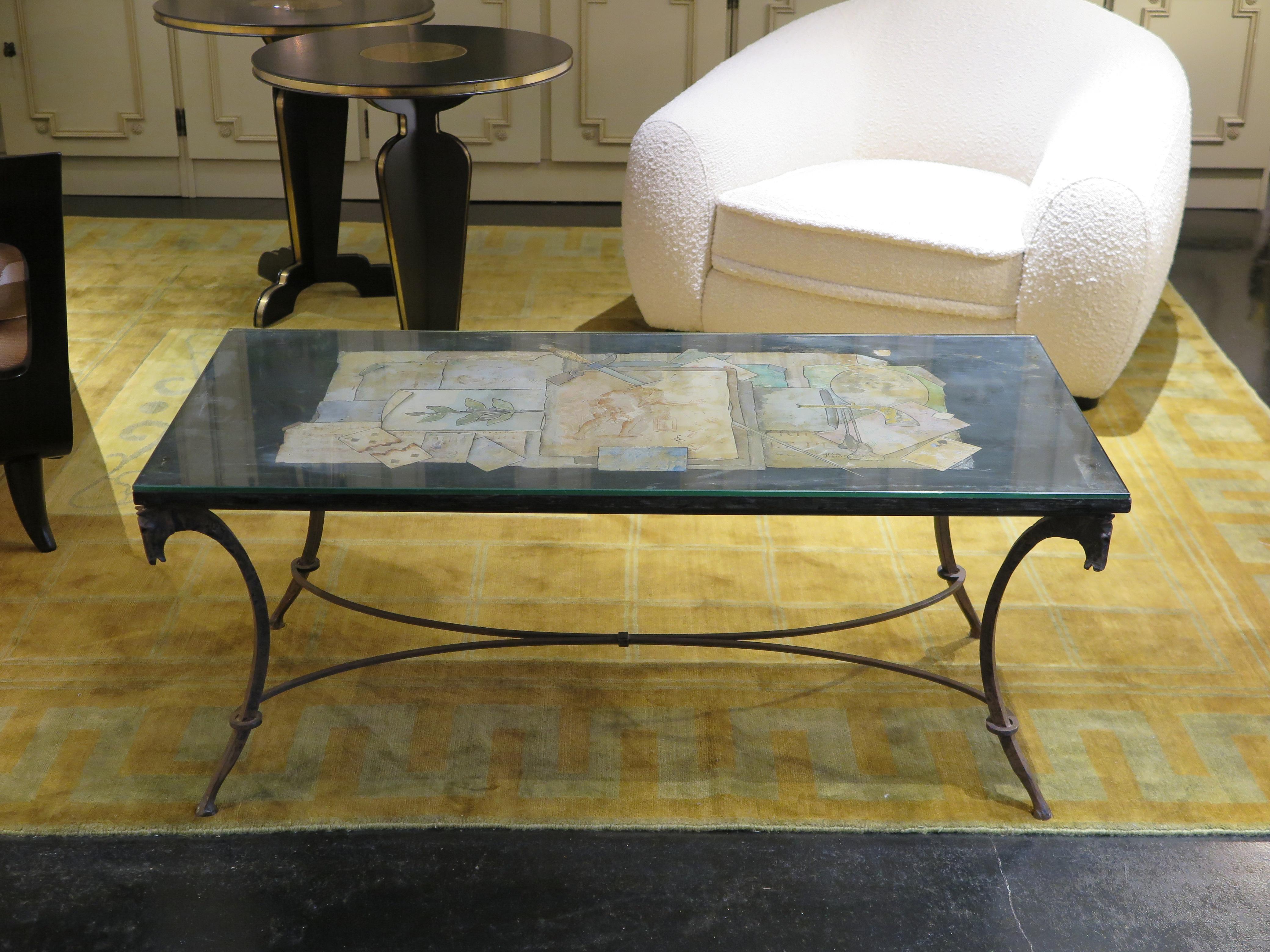 Antique coffee table by Jean Charles Moreux (1889-1956) made with black background of Scagliola (fine plaster). The top is decorated with stylized images of playing cards, engravings, drawings, botanical motifs, music sheets and a portrait of Madame