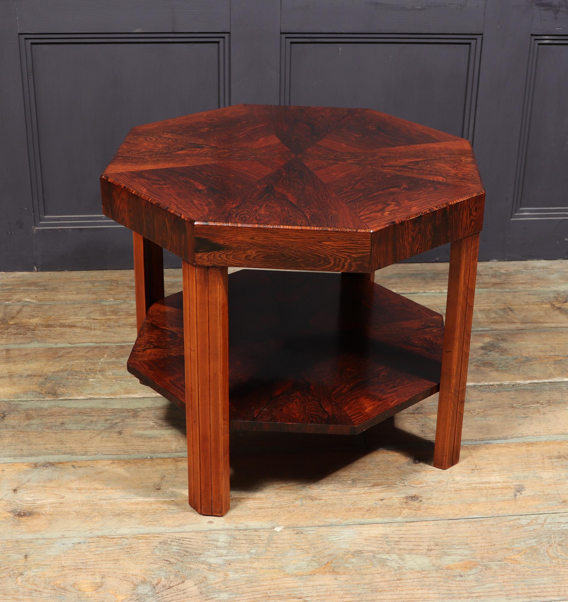 FRENCH ART DECO COFFEE TABLE 
A French Art Deco table in octagonal form, produced in rosewood and walnut in the 1930’s. It has a segmented top with chamfered edge, the lower shelf is also segmented, the table has been carefully restored and fully