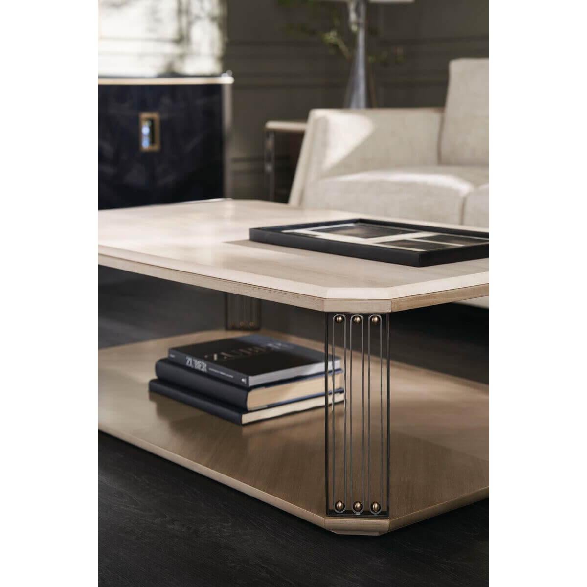 Inspired by the bent metal work of notable French designer Jean Prouvé. Features an elegant yet durable Crème Travertine stone top, softened by an ogee detail and canted corners. Ornamental legs are crafted in a fusion of Deep Bronze, Brushed Gold,