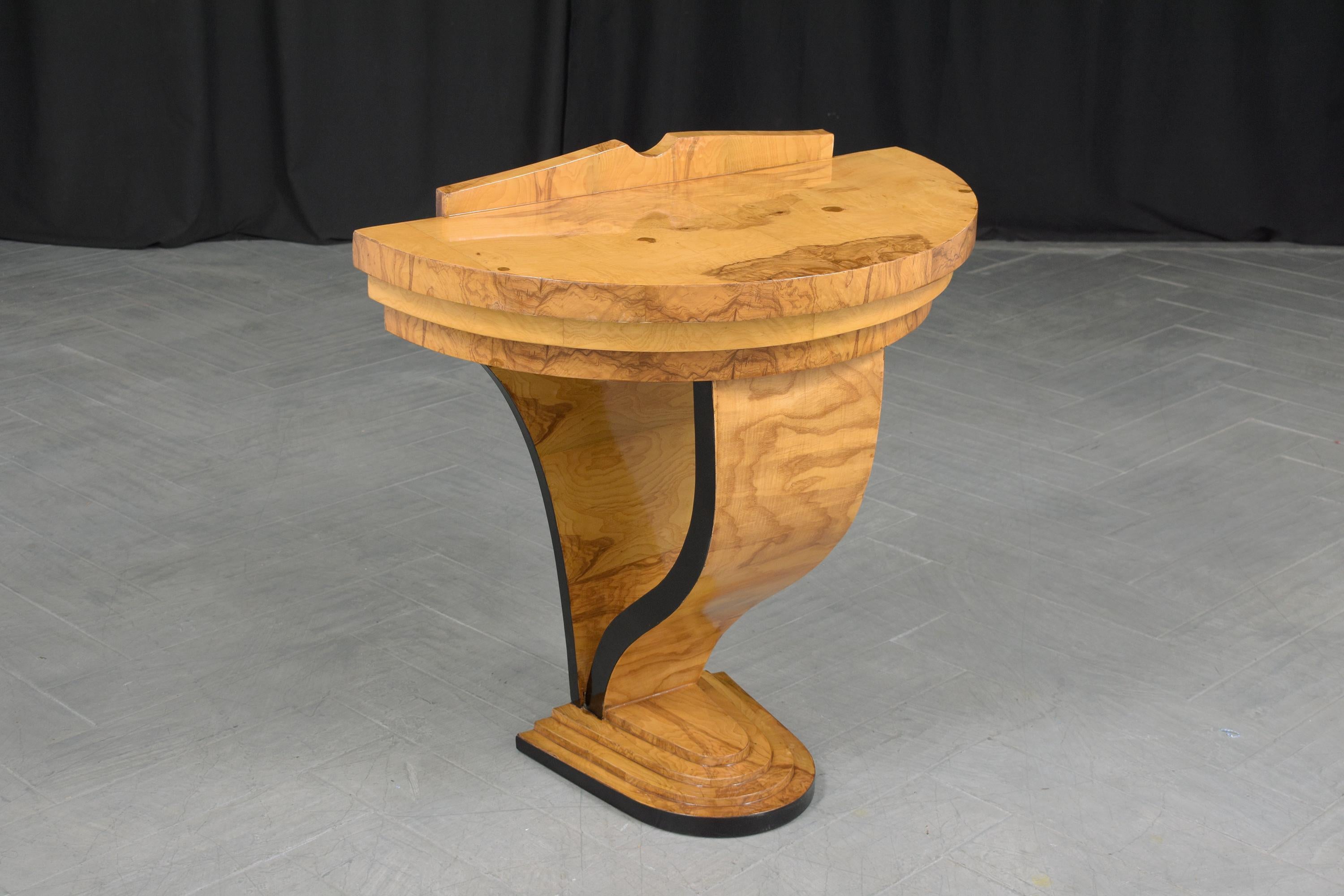 Step into the extraordinary with our stunning vintage Art Deco wall console, meticulously handcrafted from high-quality wood and birch veneers. This breathtaking piece, in great condition, has been newly restored and refinished by our dedicated team