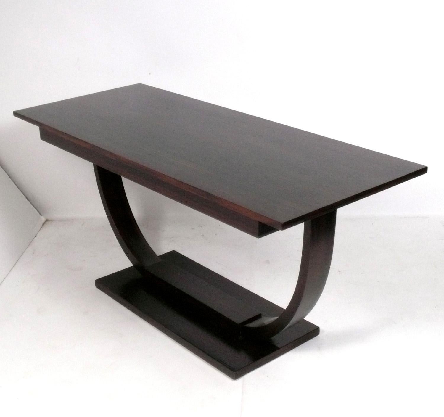 Curvaceous French Art Deco Console Table, France, circa 1930s. It is a versatile size and can be used as a console table, sofa table, desk, or bar. It has been refinished and is ready to use.