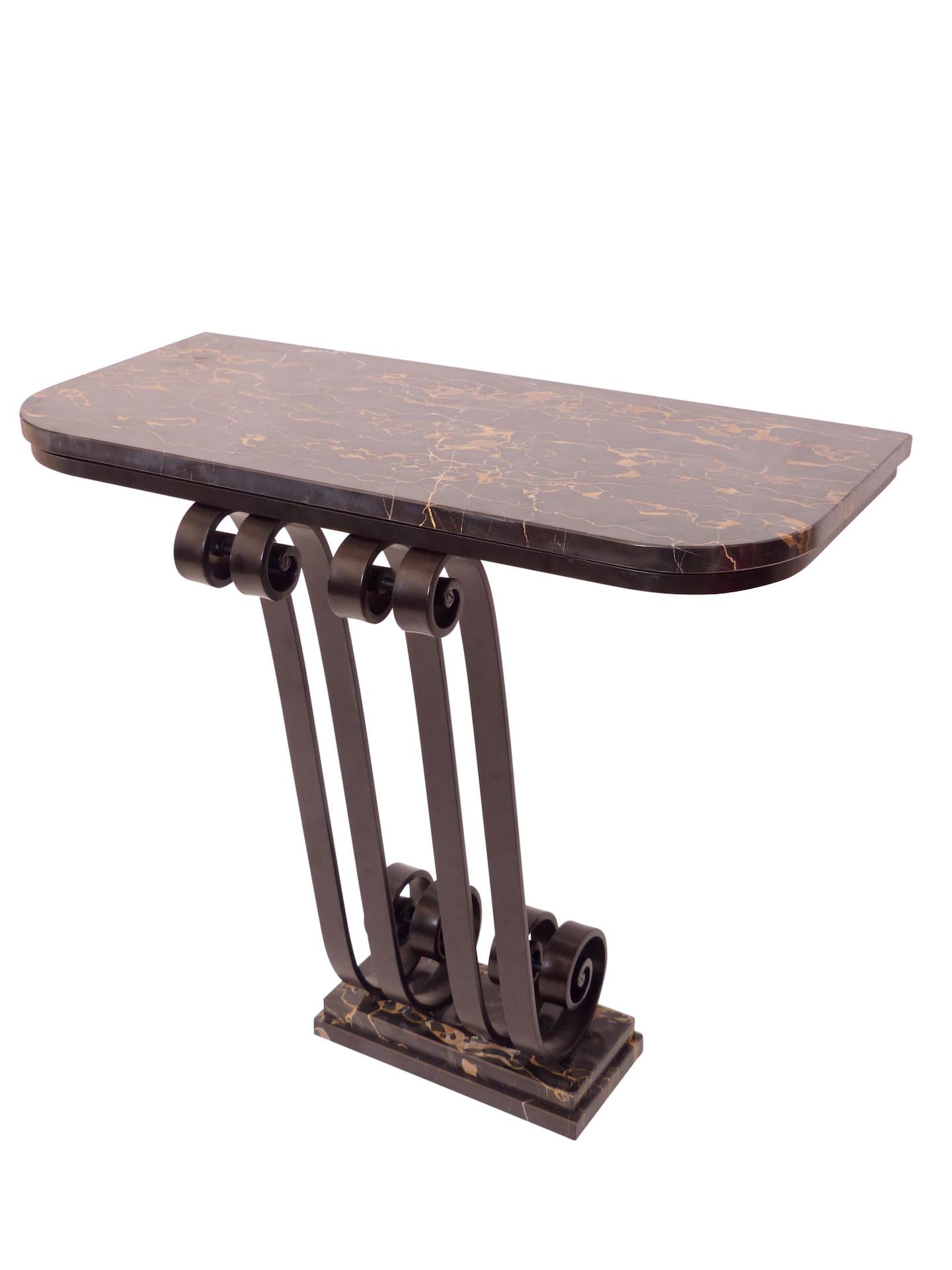 Art Deco console table 
Original Art Deco, France 1920s 

Portor marble tabletop 
Foot in wrought iron, black lacquered 
Porto marble on the foot, too 

Very heavy an good quality.
