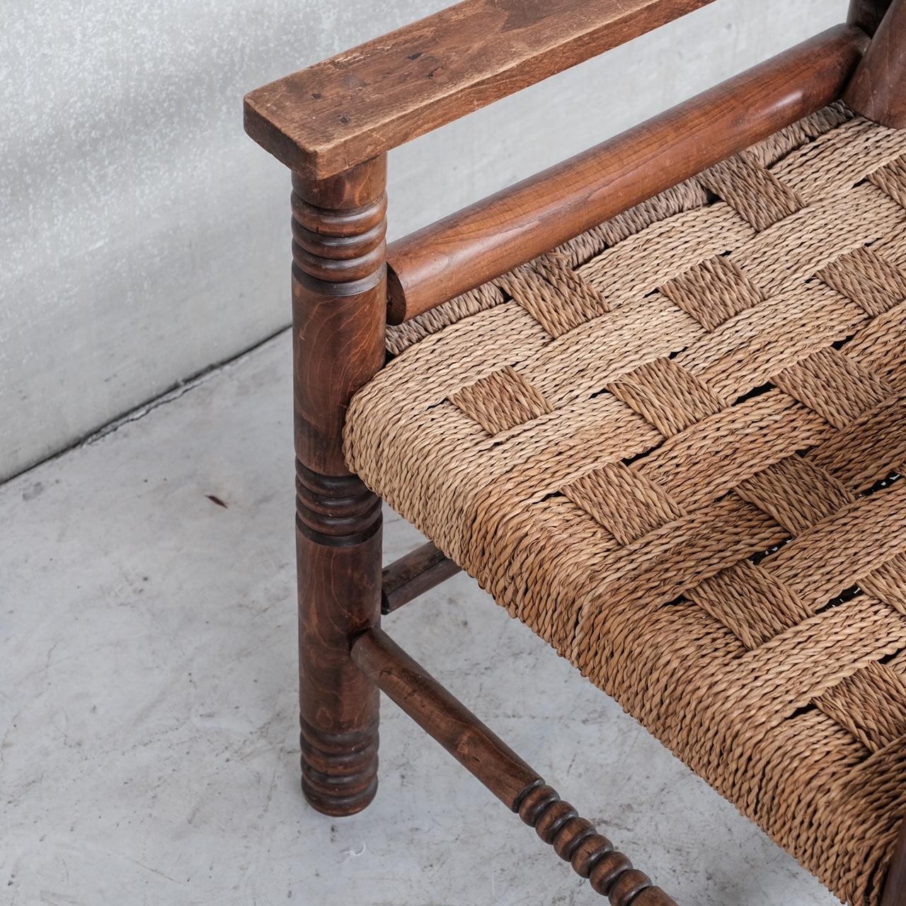 A classy oak late deco armchair attributed to French designer Charles Dudouyt. 

France, c1940s. 

Adjustable slanted back rest for comfort, lots of turned wood to the Location: Belgium Gallery. 

Dimensions: 60 W x 63 D x 44 Seat Height x 87