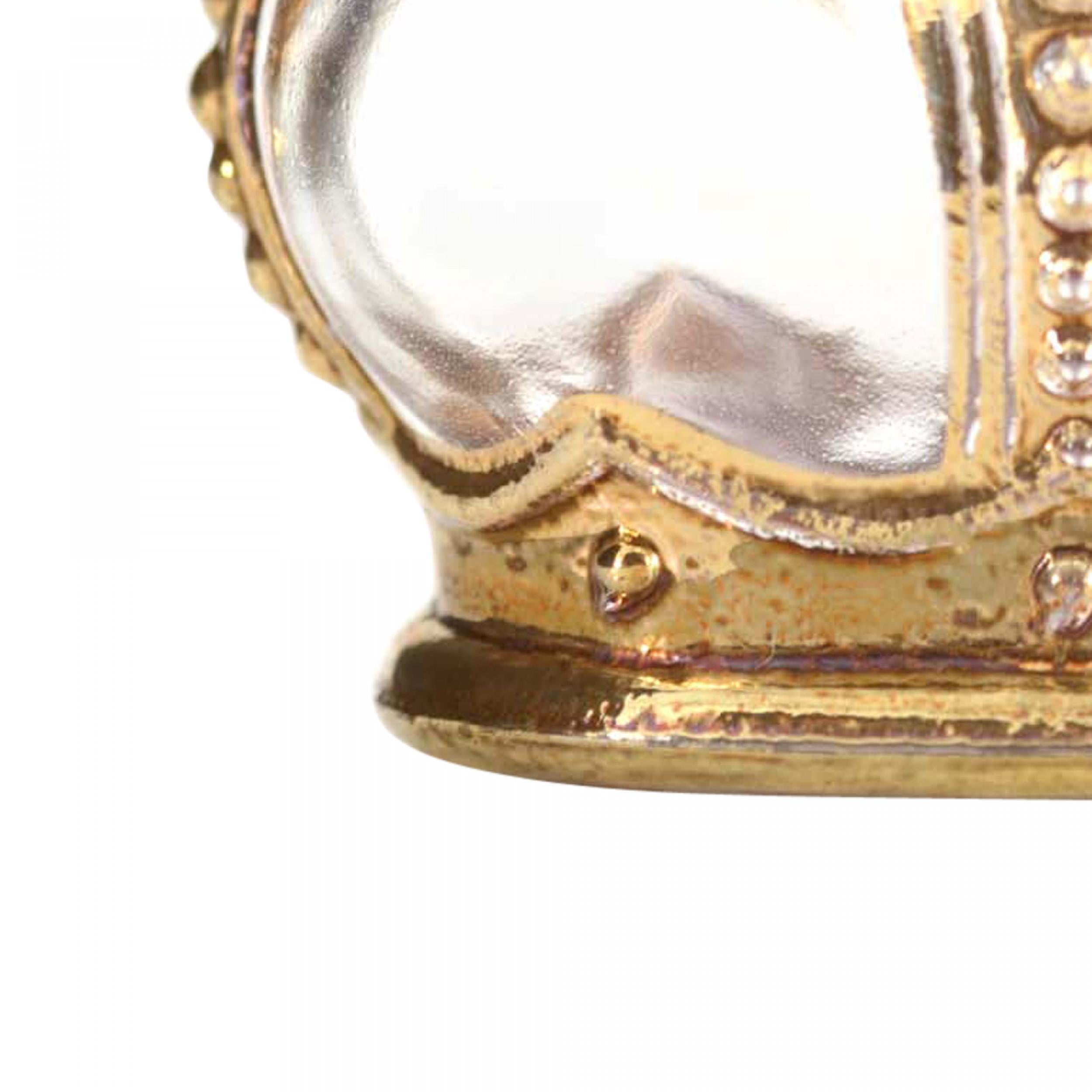French Art Deco small crown shaped clear glass perfume bottle (CROWN JEWEL by PRINCE MATCHABELLI) with gilded metal details and a Maltese cross shaped stopper.