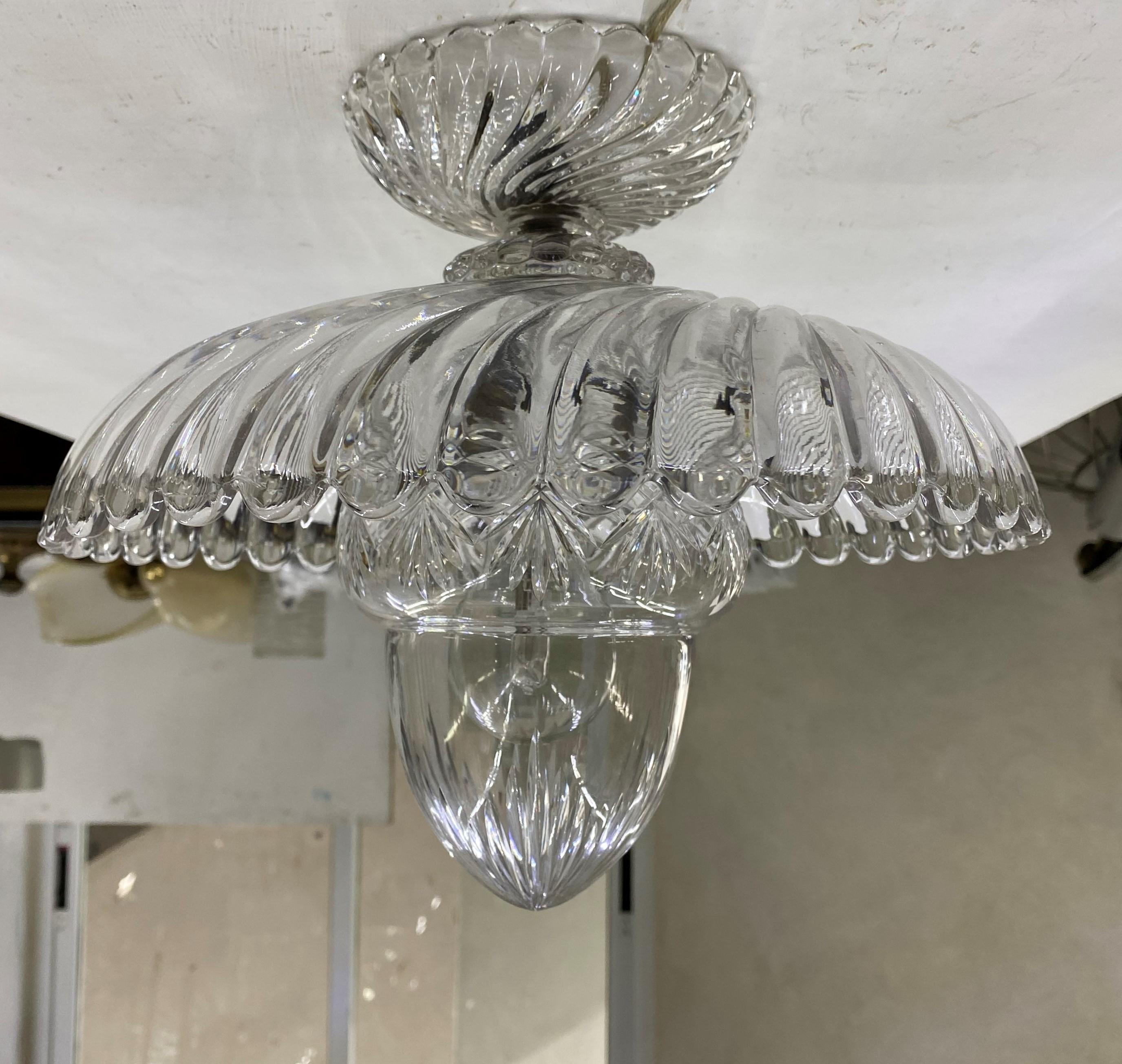 Charming chandelier with handcut central globe, most likely made by Baccarat in France, circa 1930-1940, in bronze and moulded and handcut lead crystal.
This light can be installed as a flush mount or hung from a chain if so desired.