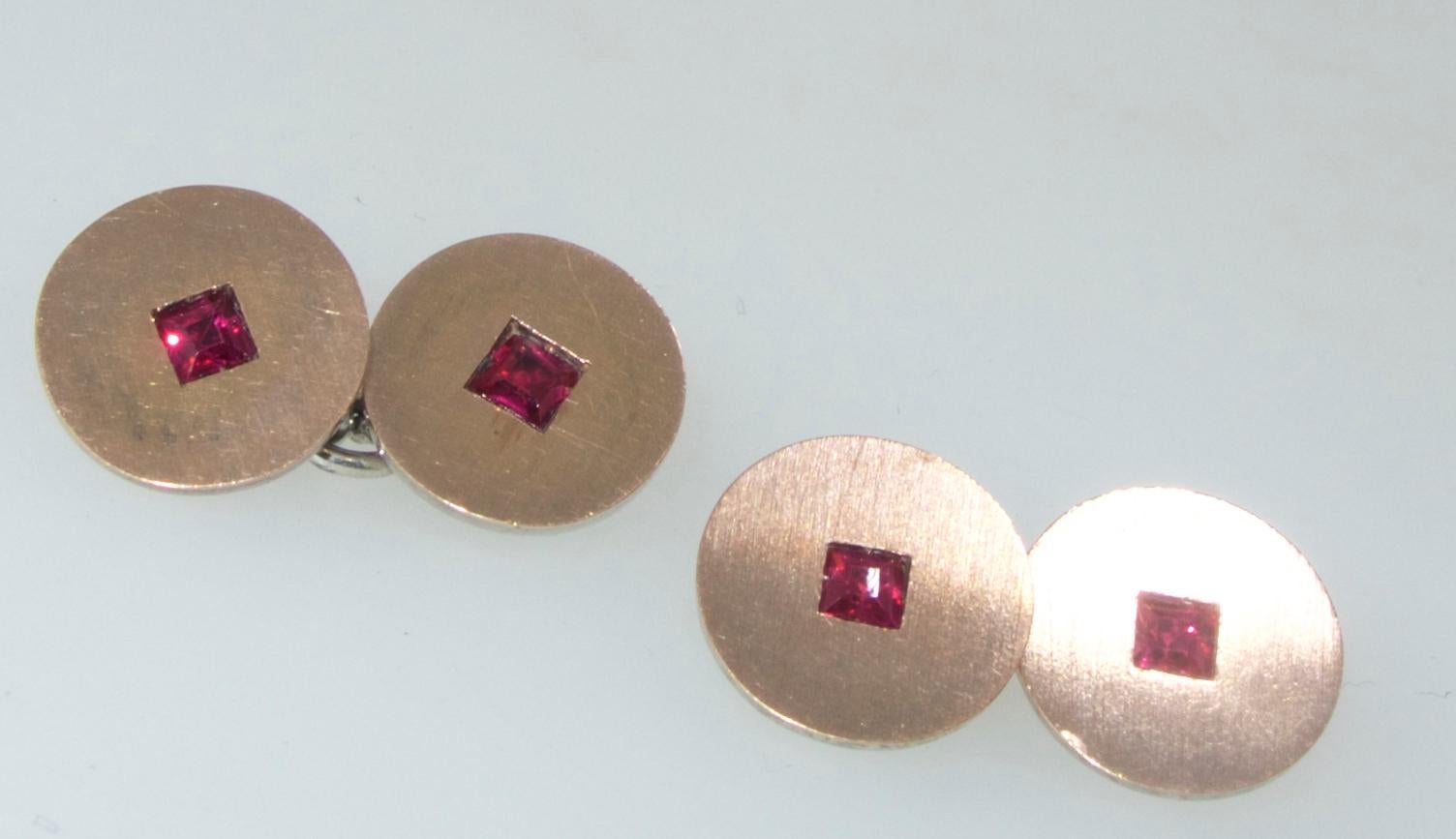 Ghiso signed and numbered cufflinks, marked 925 for silver centering a  square cut ruby (probably synthetic to be conservative as they have not been tested in a lab), these back to back cufflinks have a brushed silver face and are connected with the