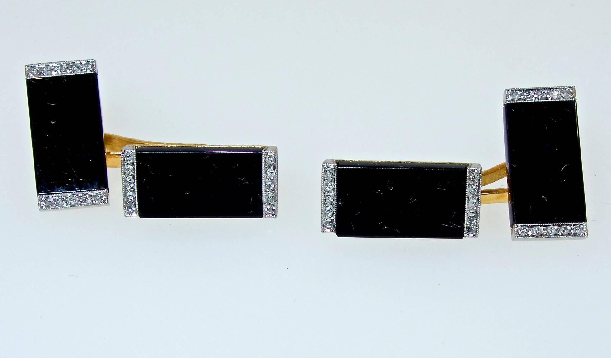 Ghiso, the famous French house made these back to back 18K cufflinks, circa 1925.  Onyx panels are bordered with 30 rose cut diamonds set in platinum.  Well made, (this type of linked center is a favorite as they are easy to put on!), geometric with