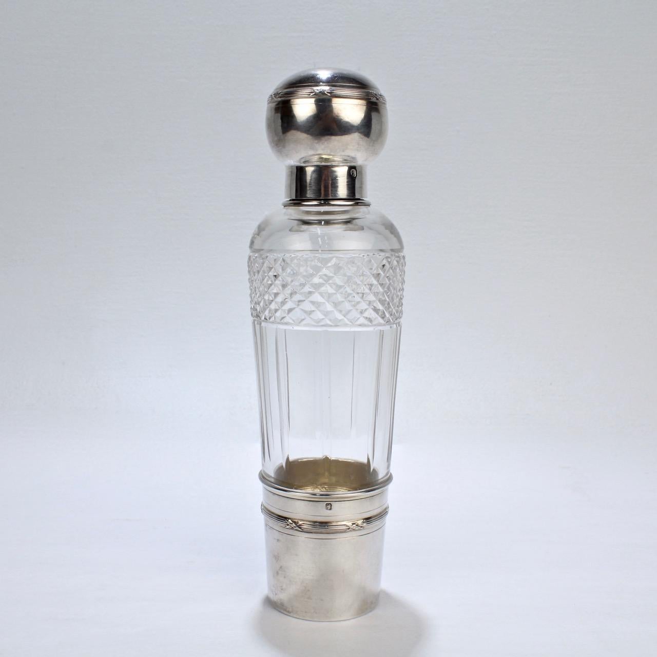 A very fine French Art Deco Flask by the Parisian jewelry maker and silversmith Albert Chambin.

In cut glass and sterling silver with a removable cup, twist-top cover, and glass stopper.

The silver hallmarked with a Medusa's head for silver