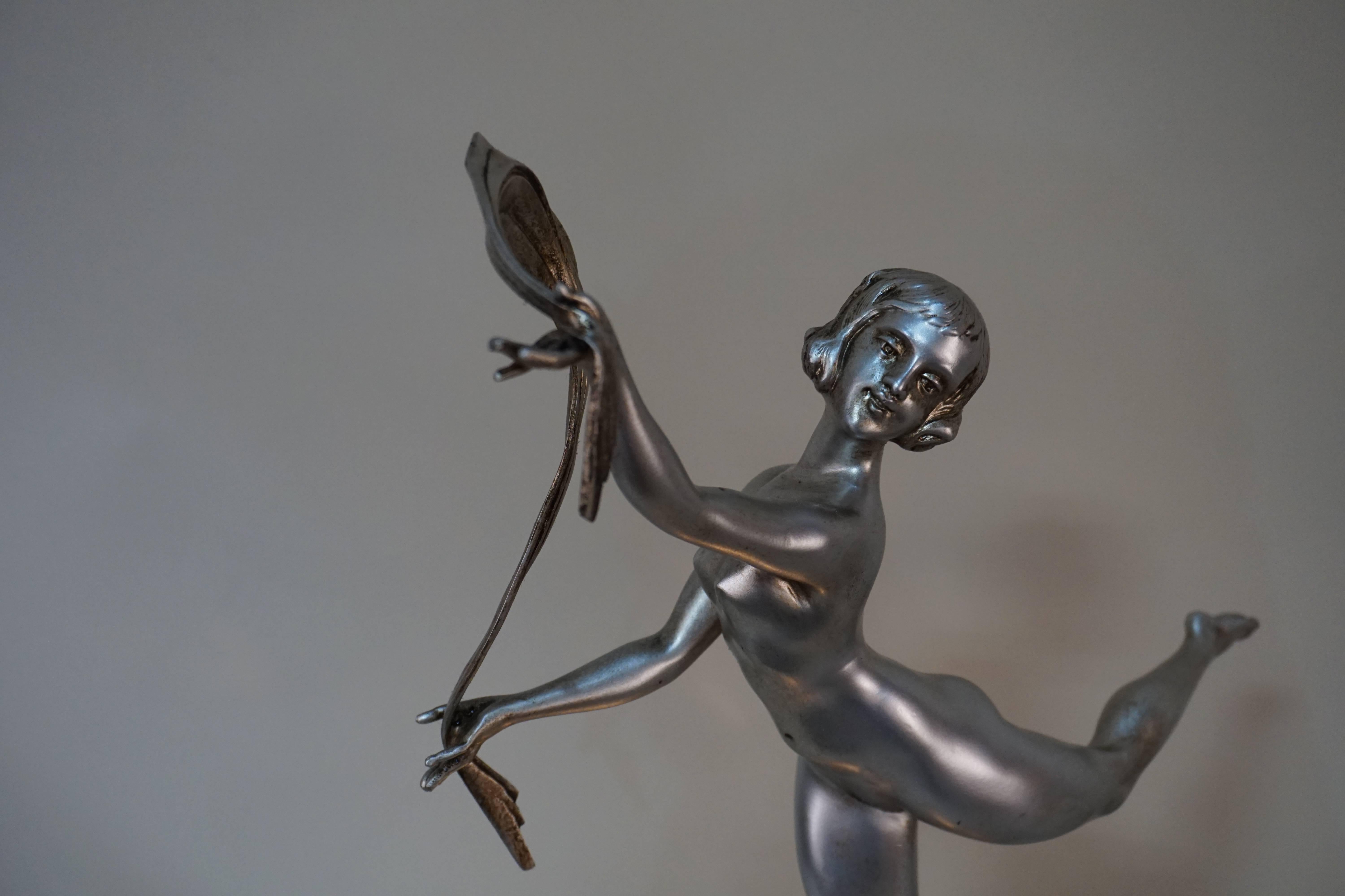 French Art Deco dancing girl over molded geometric flora glass table lamp.
 