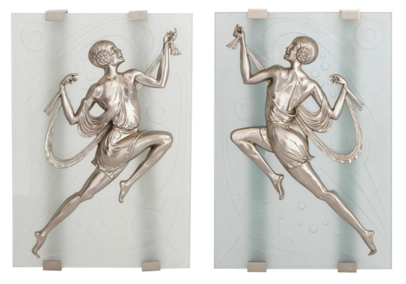 Impressive in scale, a pair of French Art Deco dancing ladies wall sconces. Depicted are front and back views of prancing female figures with draped Greek attire in dull nickeled bronze. Each figure is centered on a frosted glass panel enhanced with